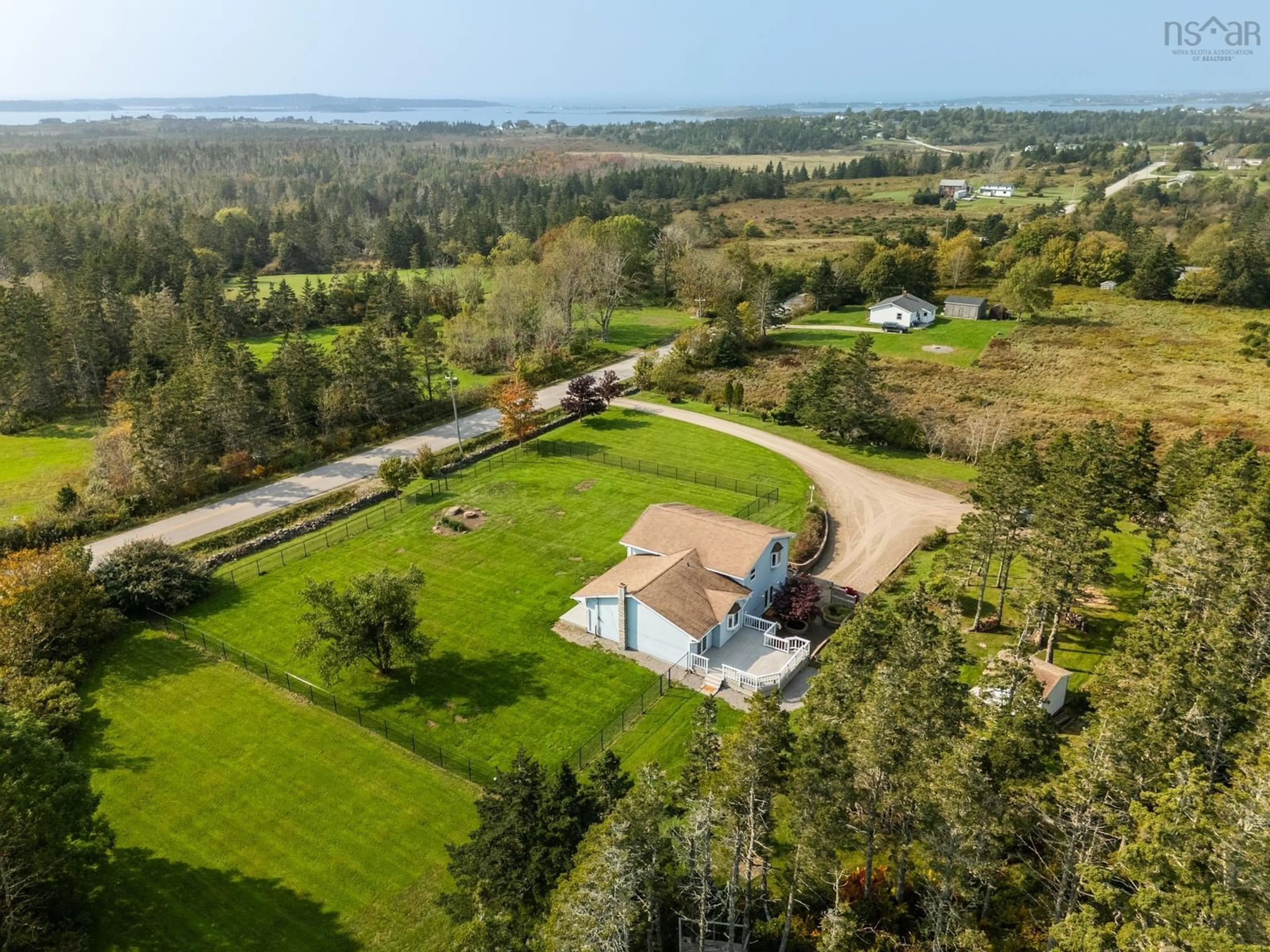 A pic from outside/outdoor area/front of a property/back of a property/a pic from drone, water/lake/river/ocean view for 470 Wyman Rd, Sand Beach Nova Scotia B5A 5G4