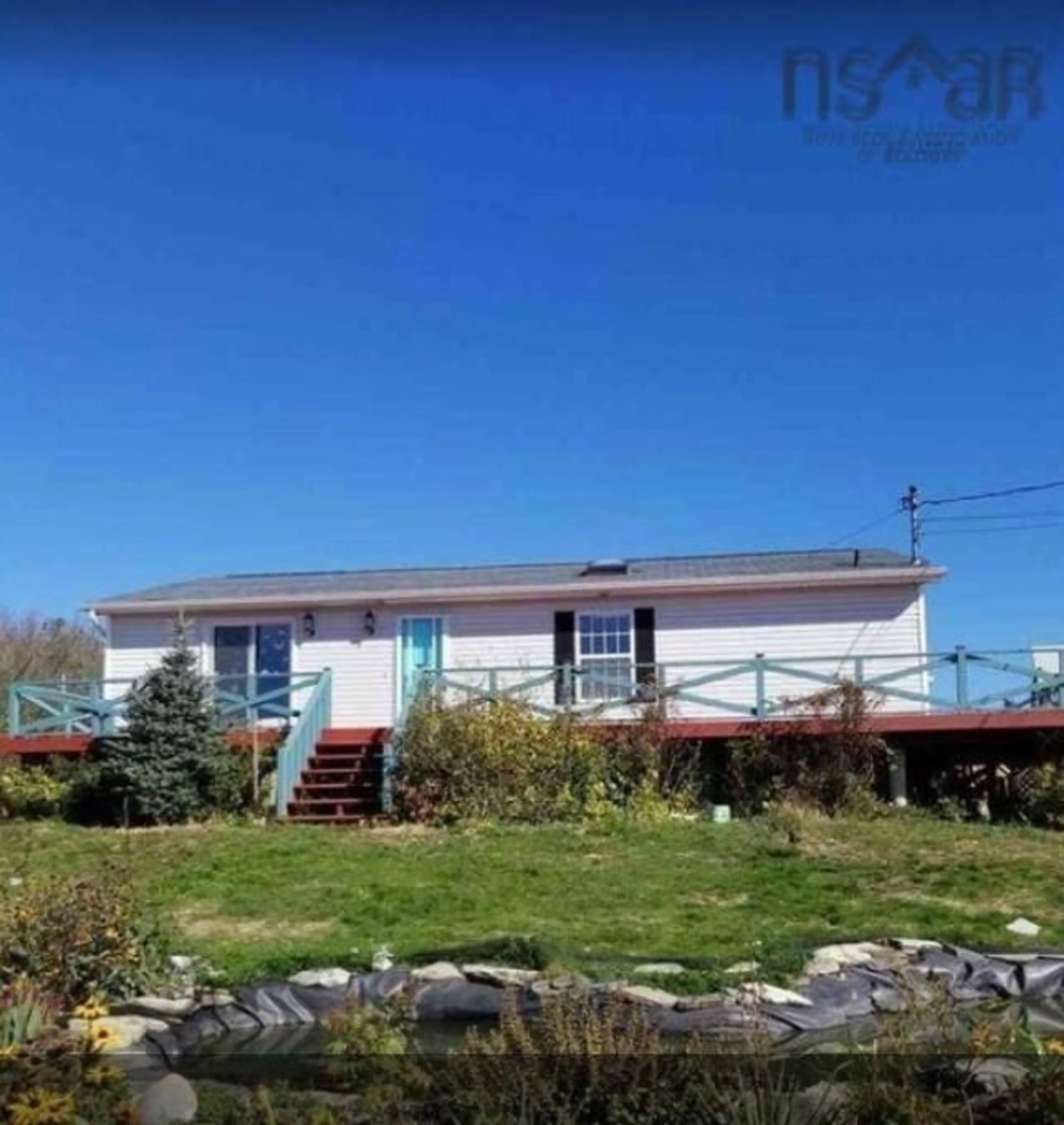 A pic from outside/outdoor area/front of a property/back of a property/a pic from drone, unknown for 1671 Sandy Point Rd, Sandy Point Nova Scotia B0T 1W0