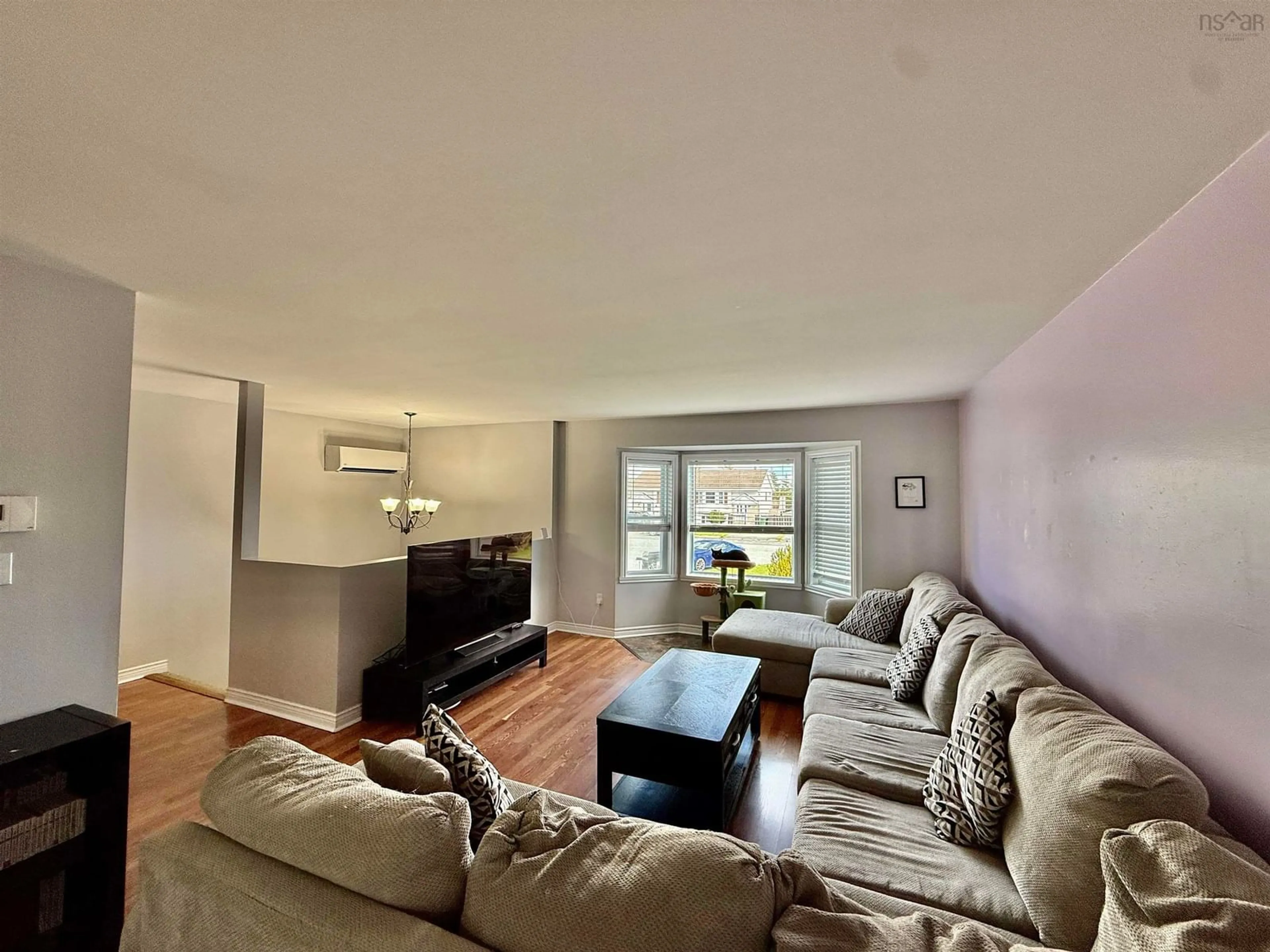 Living room with furniture, wood/laminate floor for 12 Shamrock Crt, Eastern Passage Nova Scotia B3G 1N4