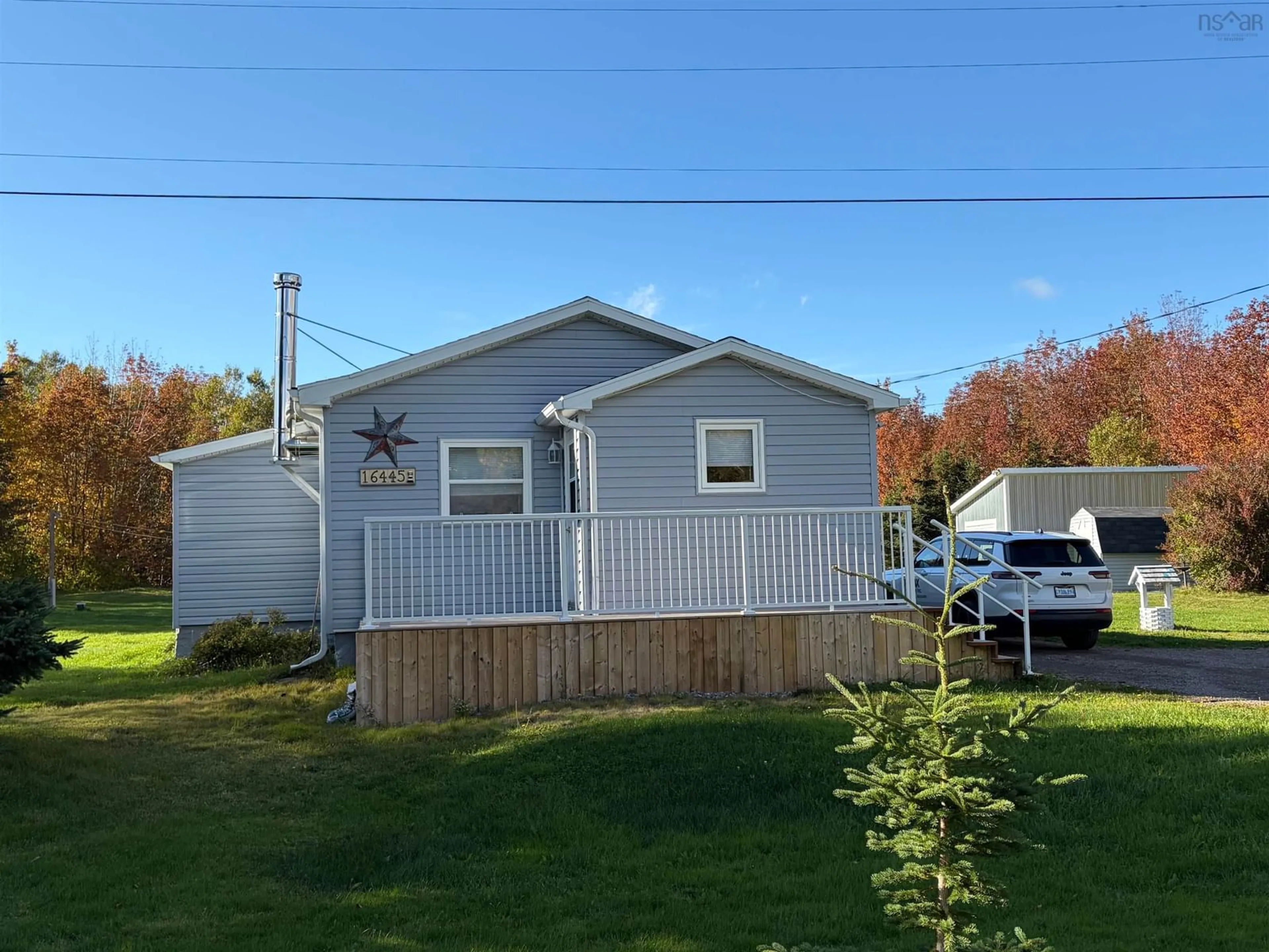 Home with vinyl exterior material, street for 16445 Cabot Trail, La Prairie Nova Scotia B0E 1H0