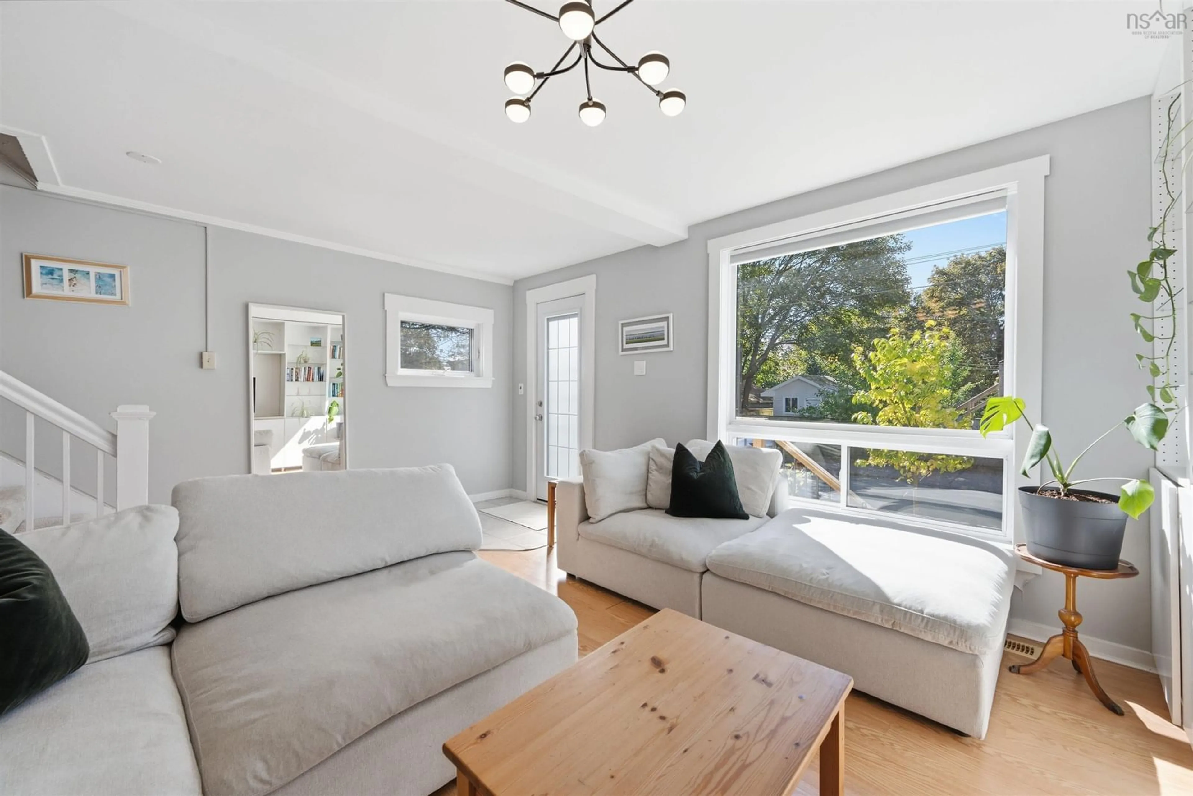 Living room with furniture, wood/laminate floor for 2457 Gladstone St, Halifax Nova Scotia B3K 4W2