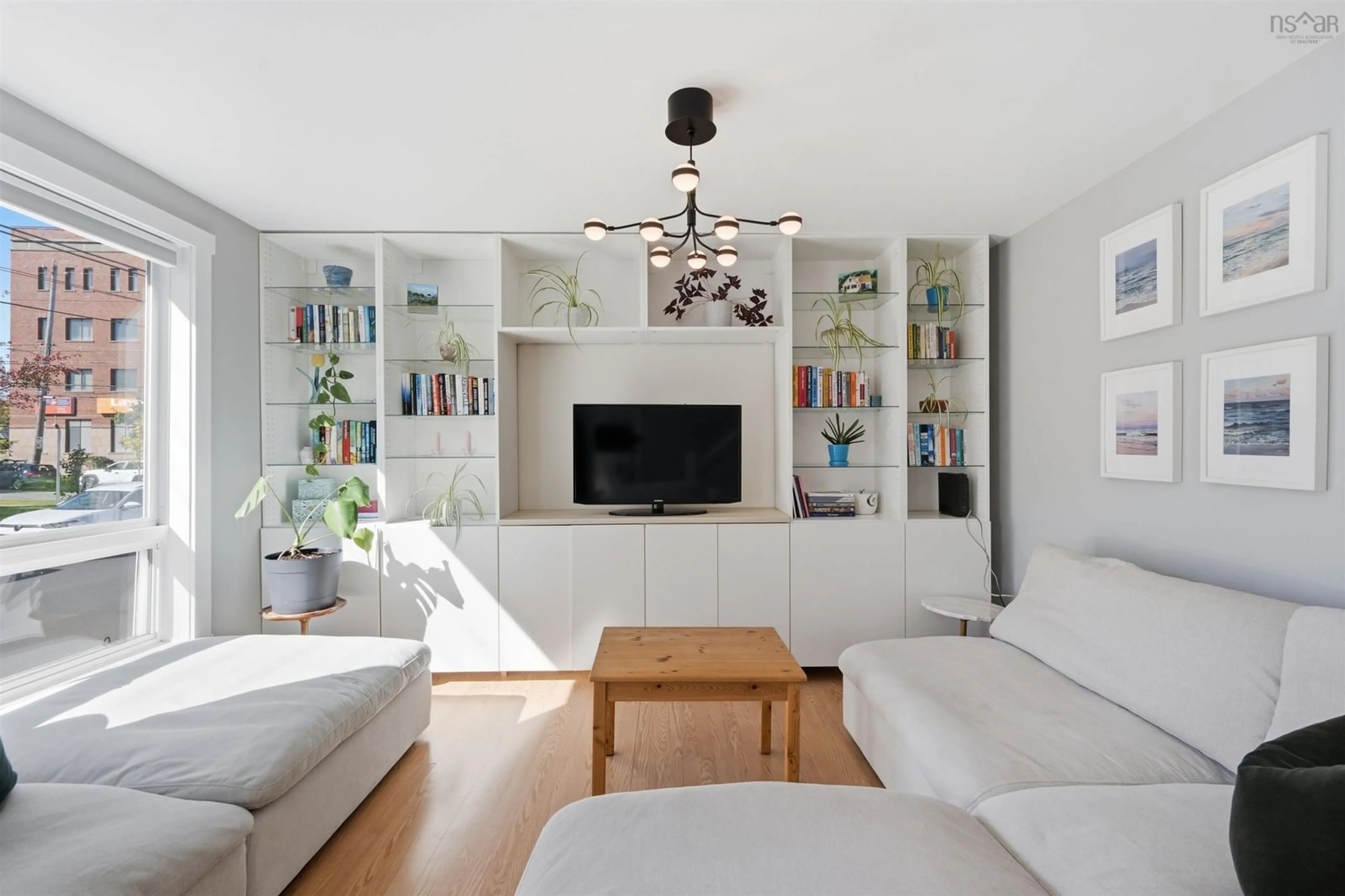 Living room with furniture, wood/laminate floor for 2457 Gladstone St, Halifax Nova Scotia B3K 4W2