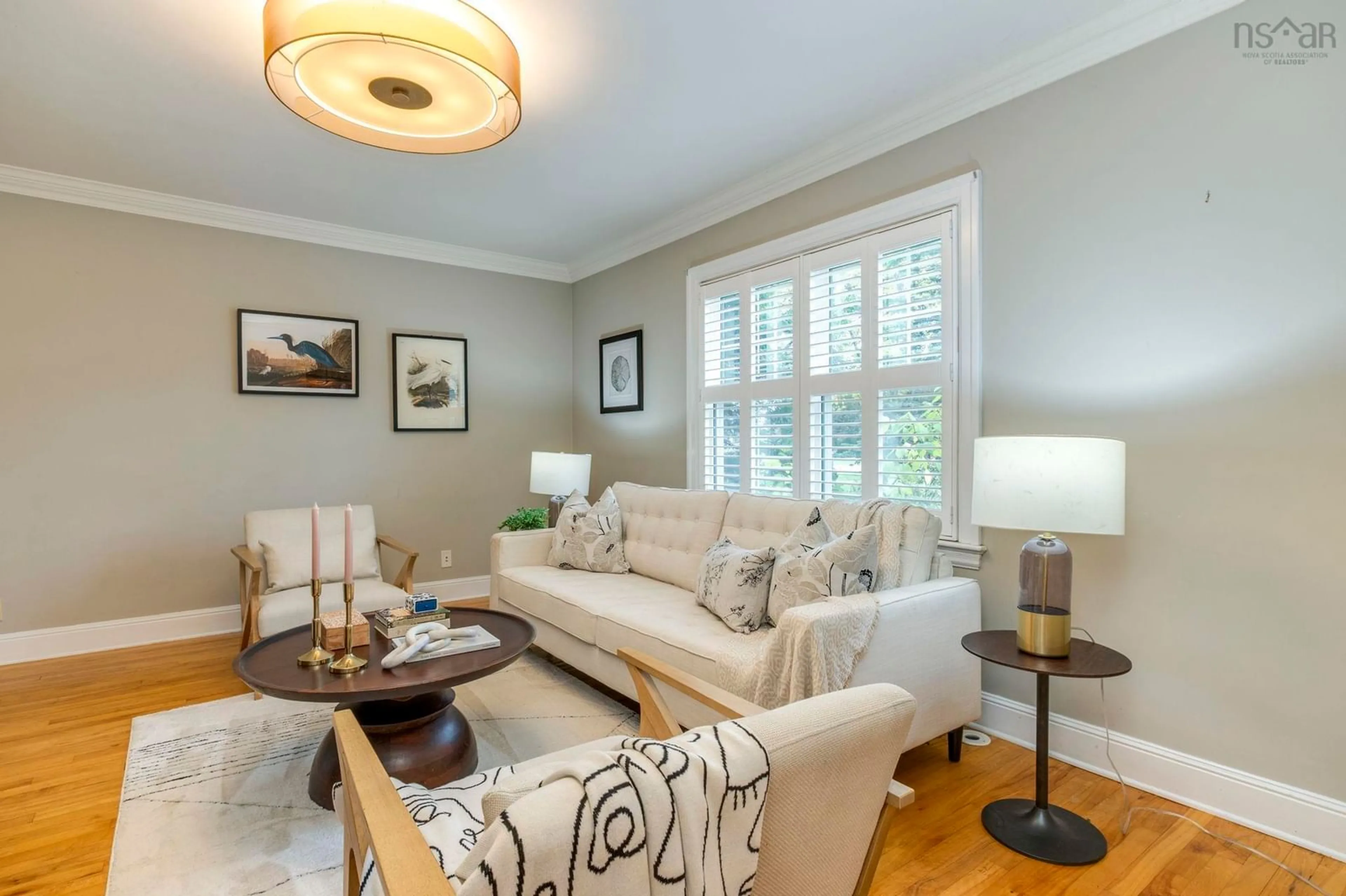 Living room with furniture, wood/laminate floor for 2561 Newton Ave, Halifax Nova Scotia B3L 3C4