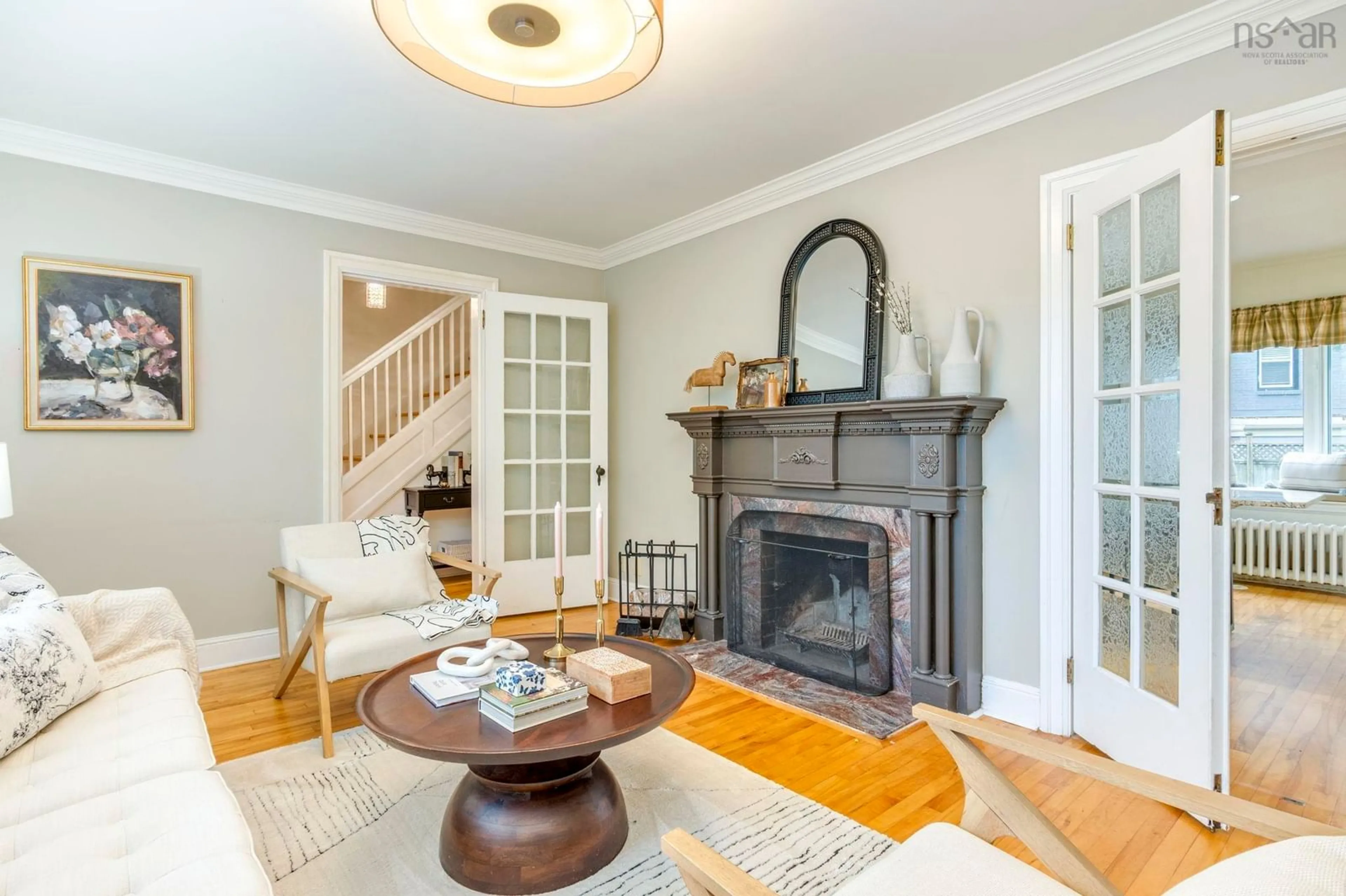 Living room with furniture, wood/laminate floor for 2561 Newton Ave, Halifax Nova Scotia B3L 3C4