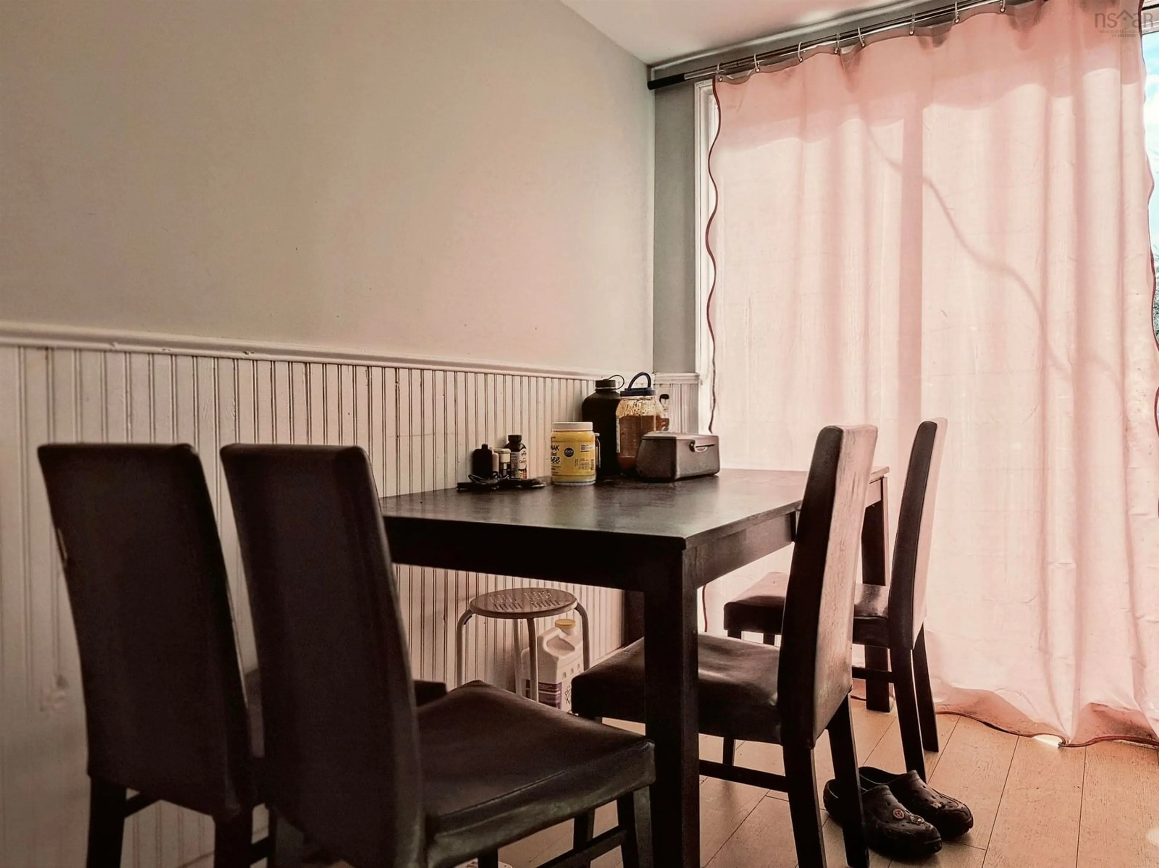 Dining room, wood/laminate floor for 12 Summer St, Murray Siding Nova Scotia B6L 4J8
