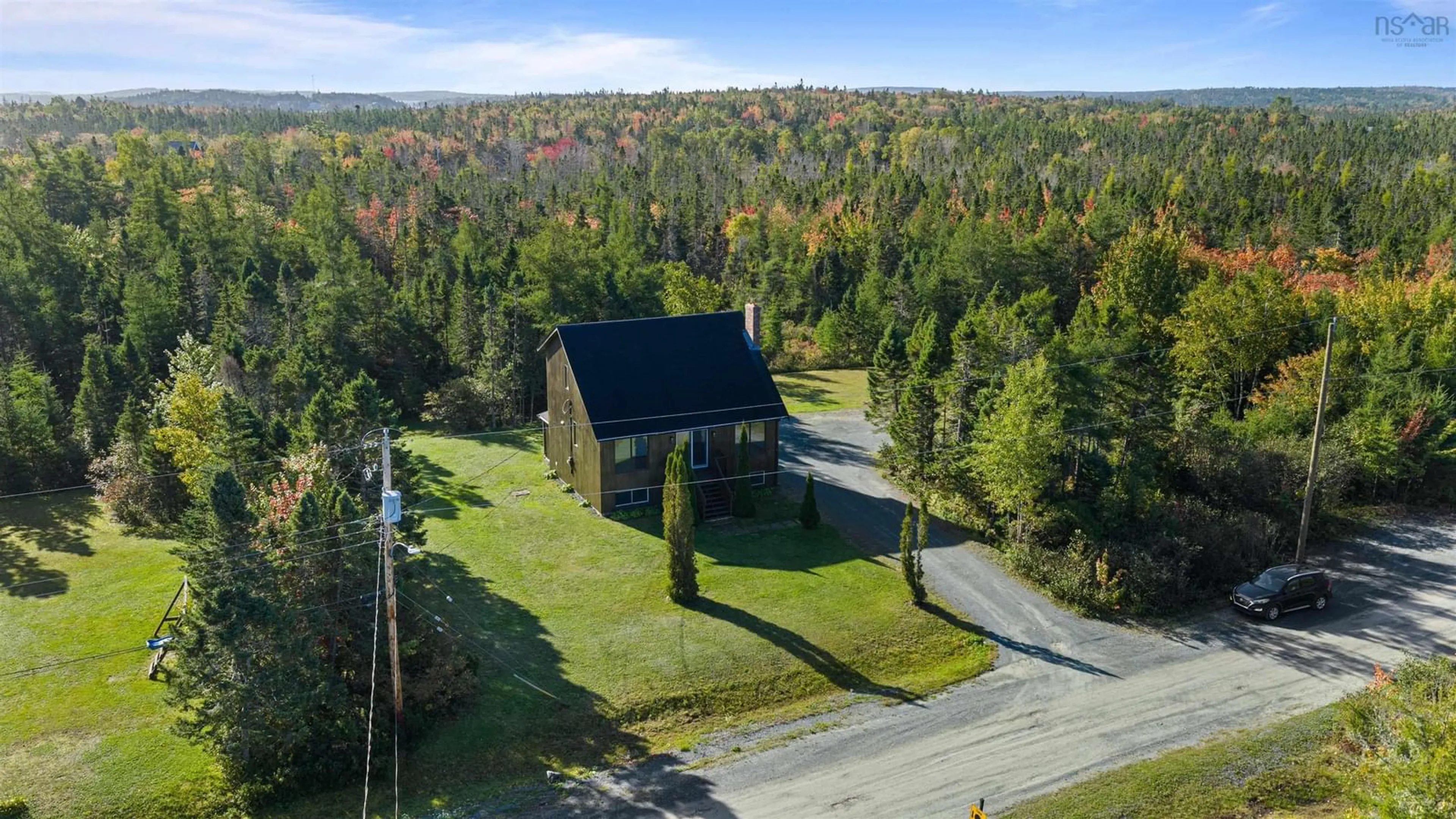 A pic from outside/outdoor area/front of a property/back of a property/a pic from drone, forest/trees view for 5 Corrie Lane, West Porters Lake Nova Scotia B3E 1L1