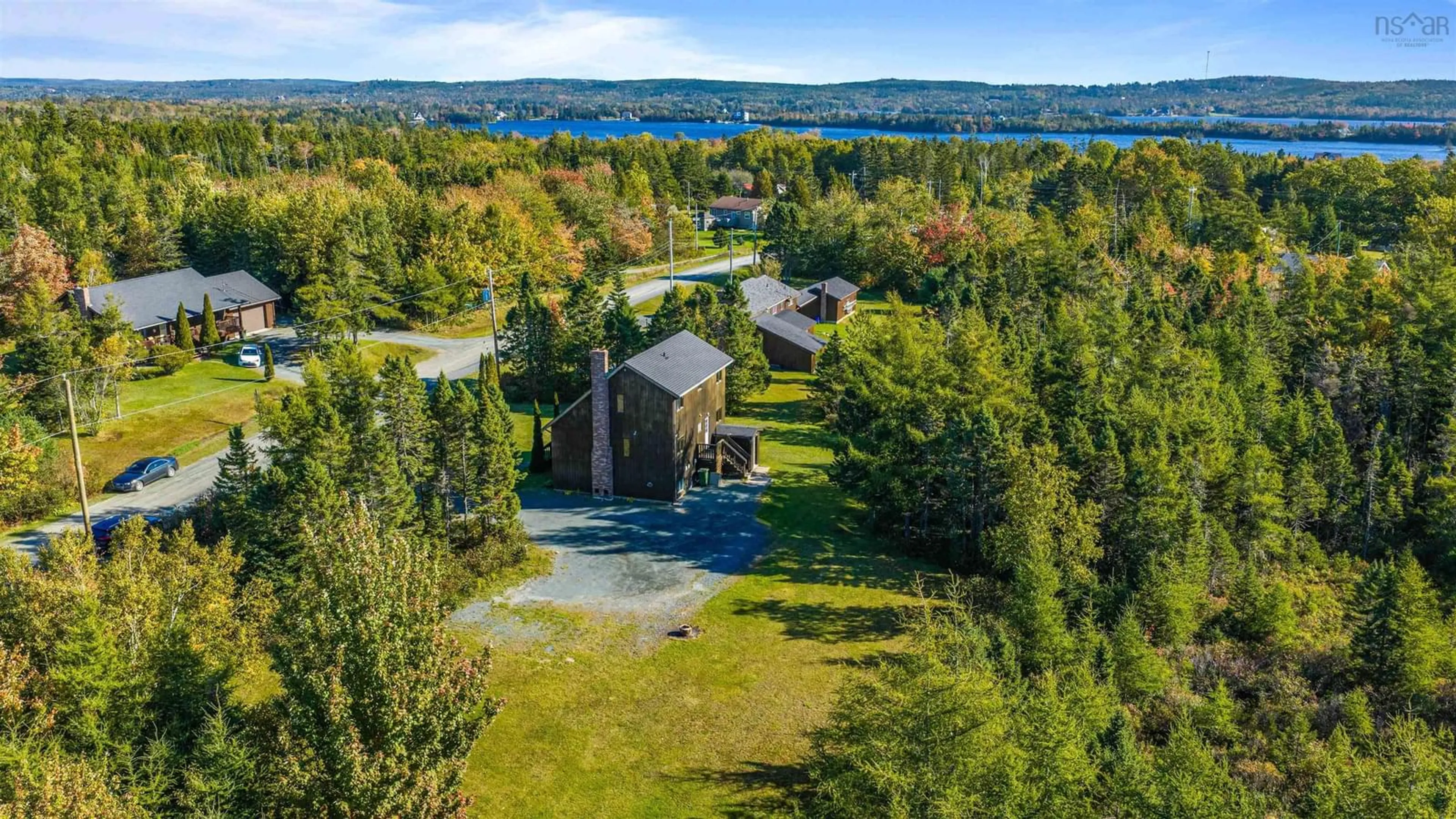 A pic from outside/outdoor area/front of a property/back of a property/a pic from drone, water/lake/river/ocean view for 5 Corrie Lane, West Porters Lake Nova Scotia B3E 1L1