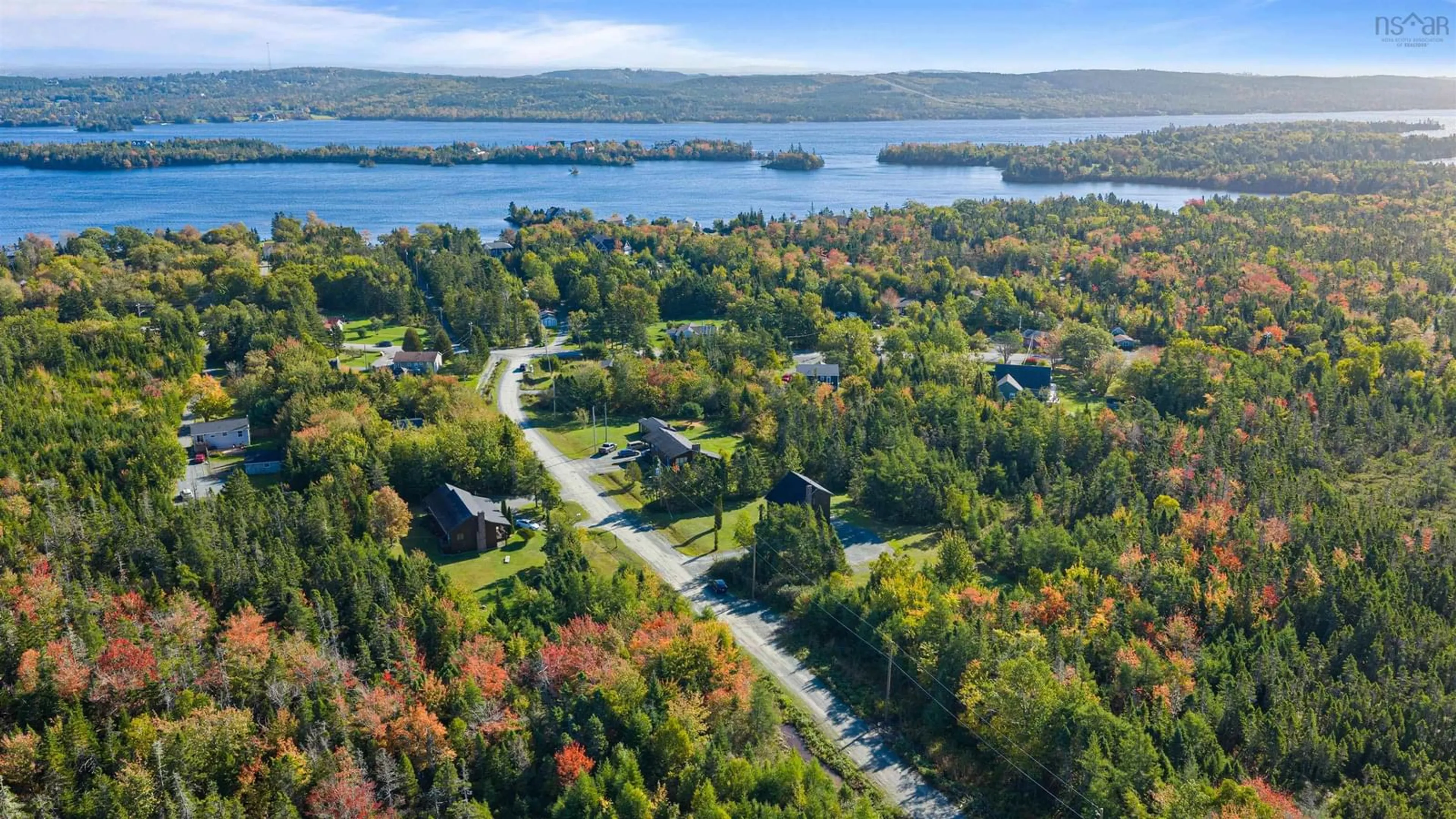 A pic from outside/outdoor area/front of a property/back of a property/a pic from drone, water/lake/river/ocean view for 5 Corrie Lane, West Porters Lake Nova Scotia B3E 1L1