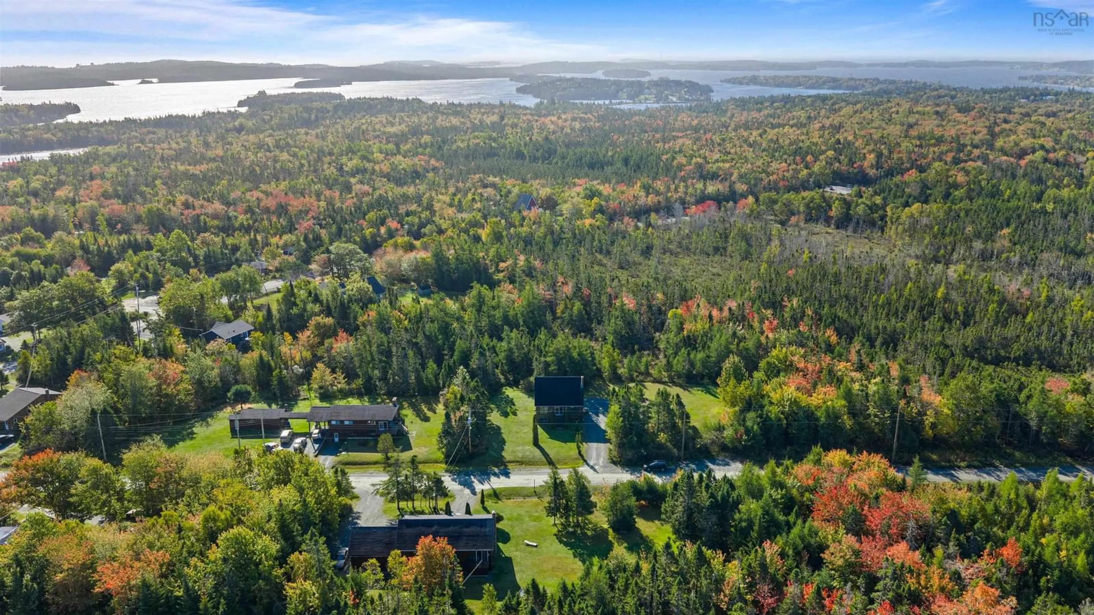 A pic from outside/outdoor area/front of a property/back of a property/a pic from drone, water/lake/river/ocean view for 5 Corrie Lane, West Porters Lake Nova Scotia B3E 1L1