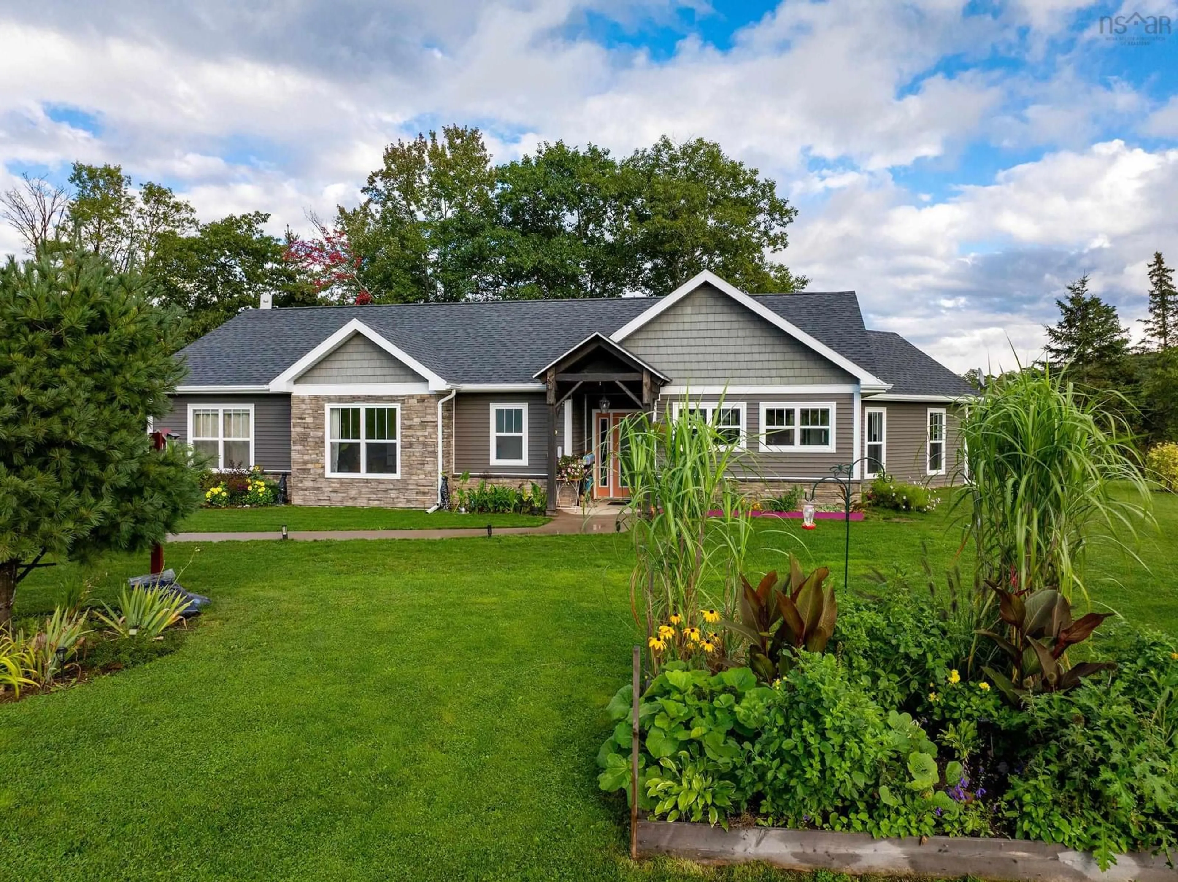 Home with vinyl exterior material, street for 48 Festival Lane, MacKay Siding Nova Scotia B0N 2J0