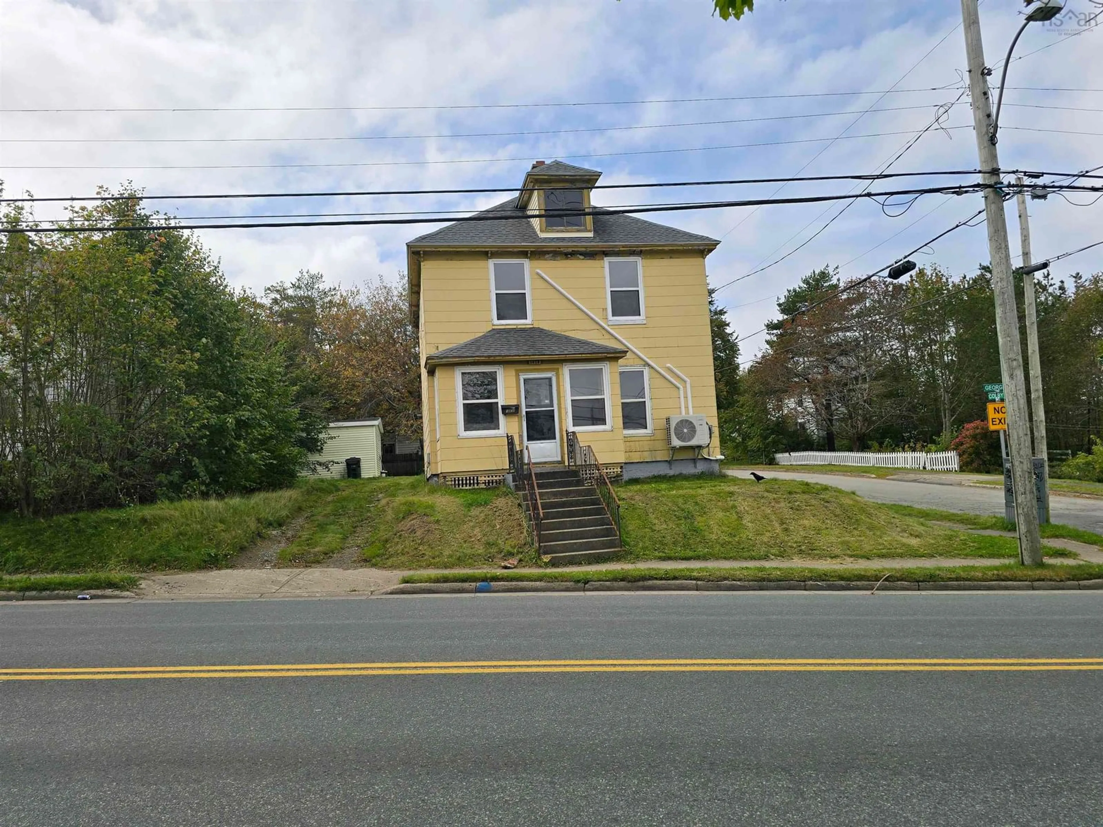 A pic from outside/outdoor area/front of a property/back of a property/a pic from drone, street for 1038 George St, Sydney Nova Scotia B1P 1M8