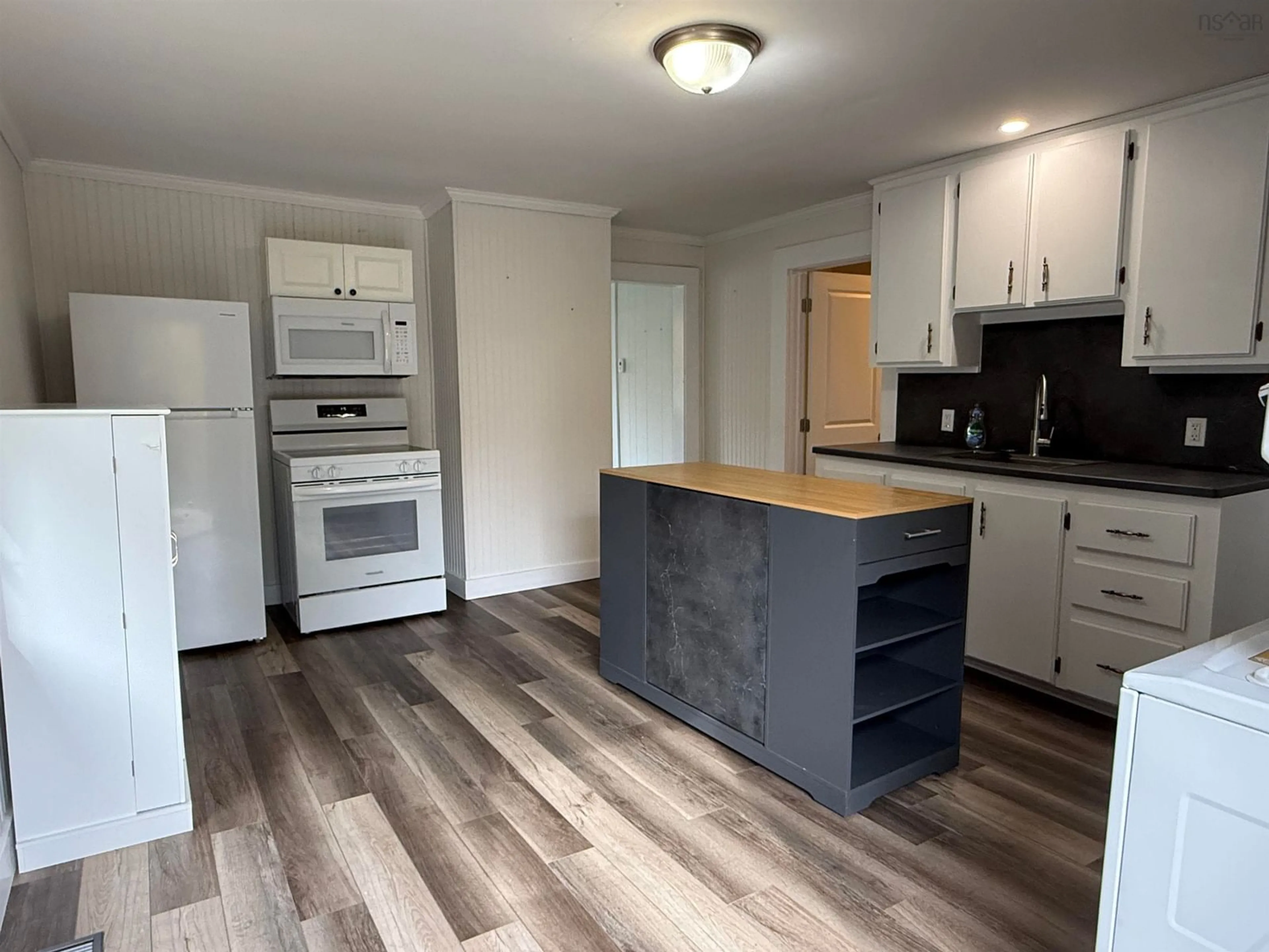 Open concept kitchen, wood/laminate floor for 248 Munroe Avenue Exten, Westville Road Nova Scotia B2H 2J6