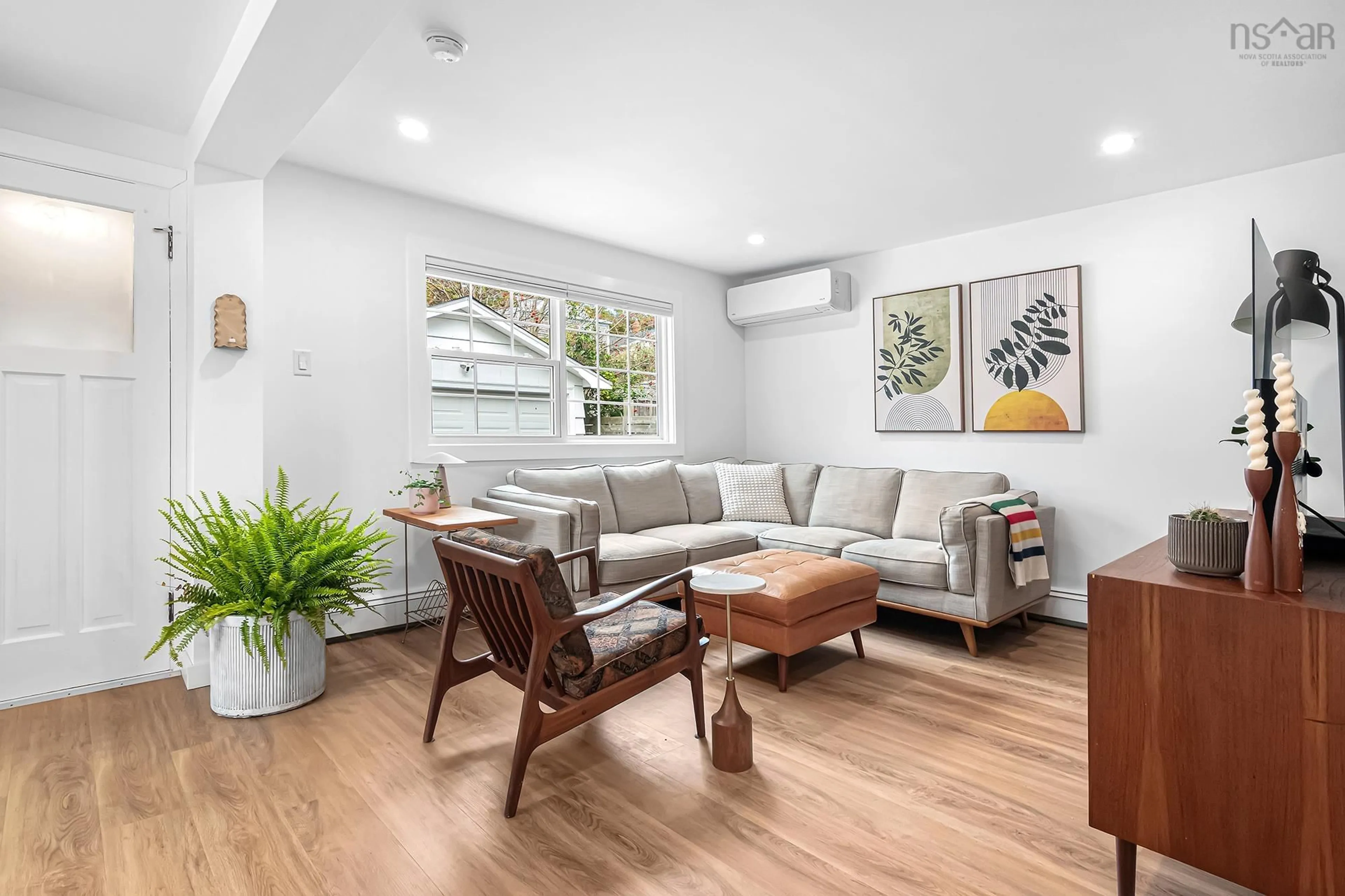 Living room with furniture, wood/laminate floor for 5879 Stairs St, Halifax Nova Scotia B3K 2E2
