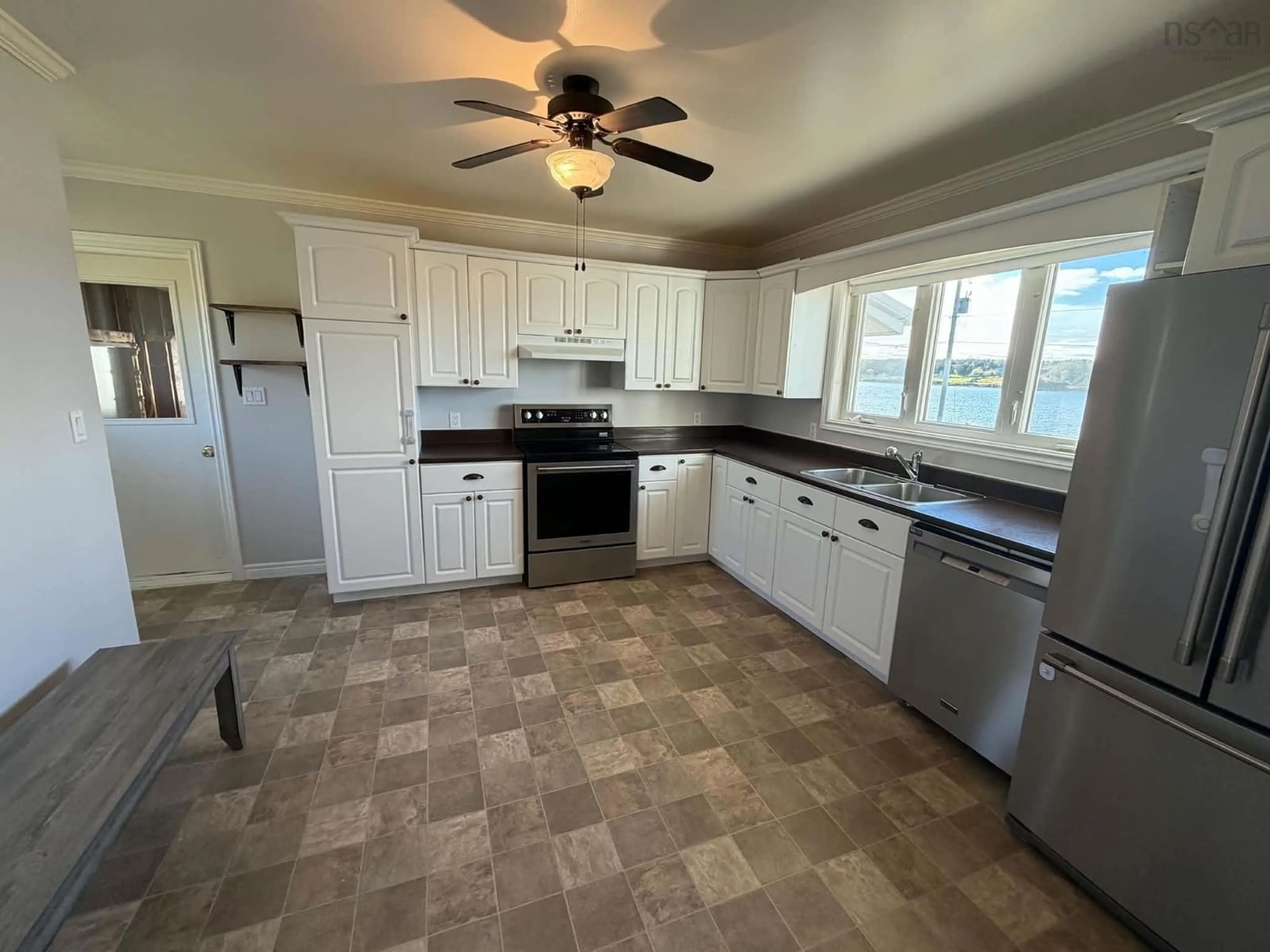 Open concept kitchen, ceramic/tile floor for 81 La Pointe Du Havre Rd, Chéticamp Nova Scotia B0E 1H0