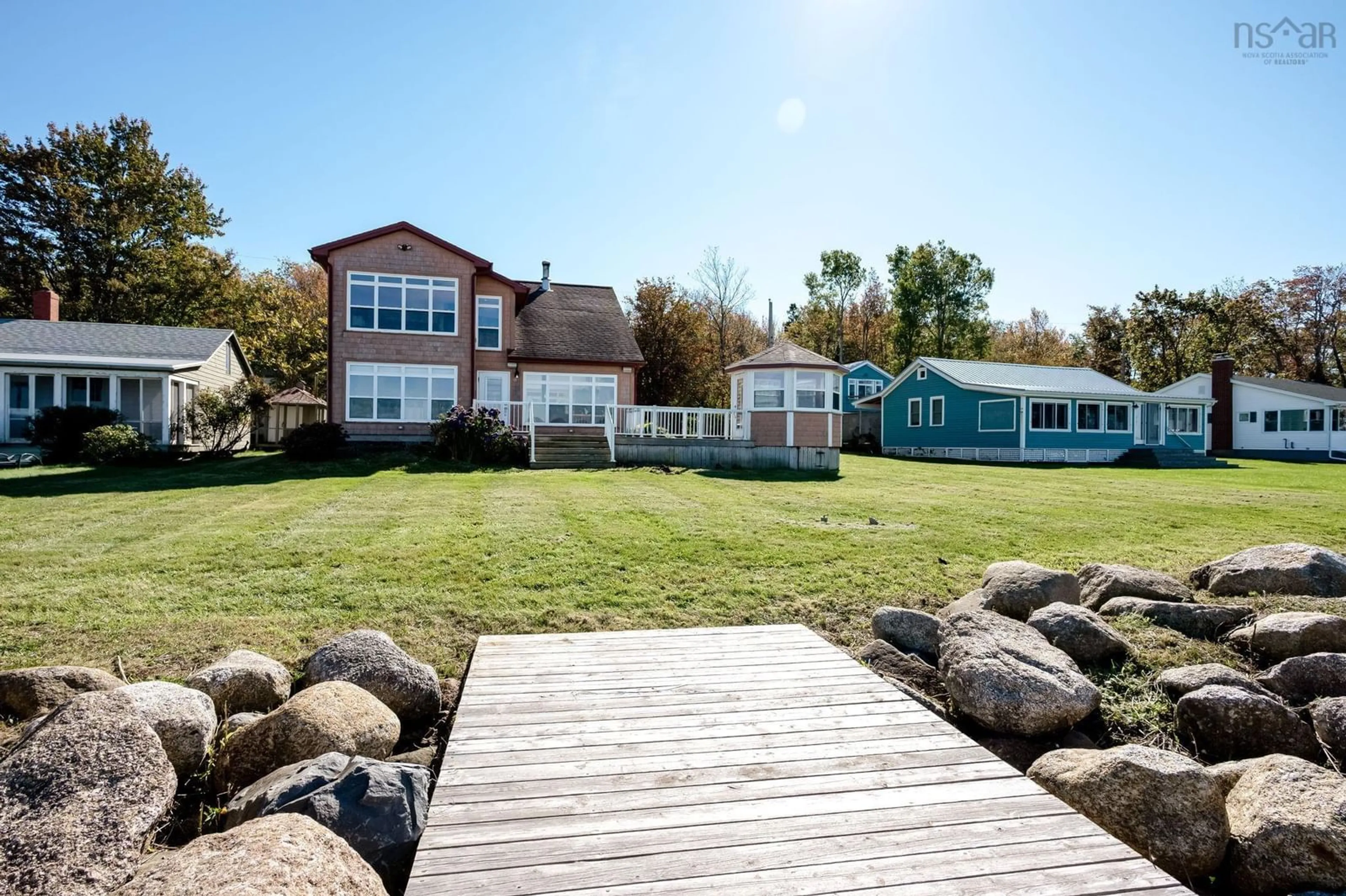 A pic from outside/outdoor area/front of a property/back of a property/a pic from drone, water/lake/river/ocean view for 157/161 Beach Row, North Grand Pre Nova Scotia B0P 1M0