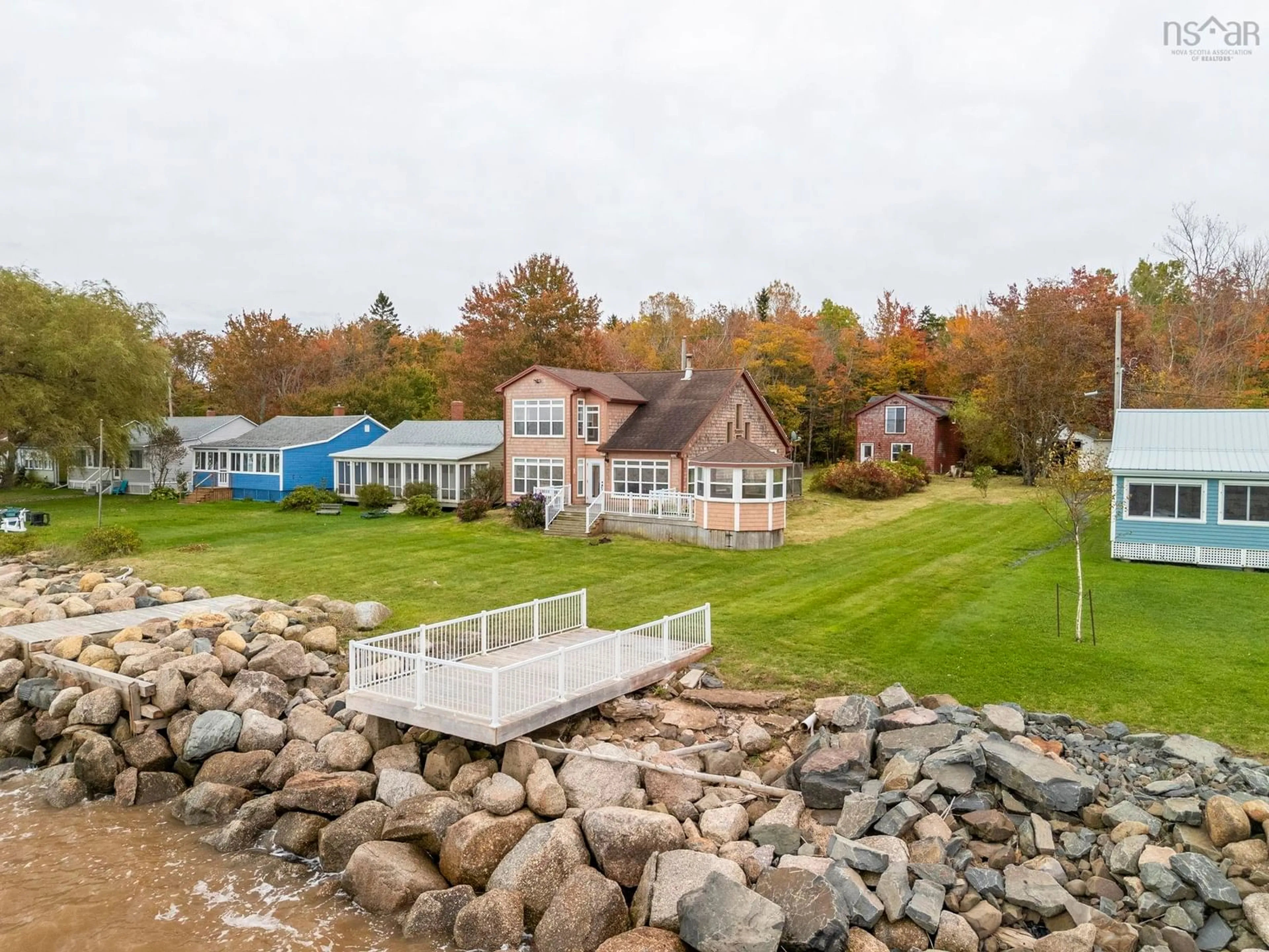 A pic from outside/outdoor area/front of a property/back of a property/a pic from drone, water/lake/river/ocean view for 157/161 Beach Row, North Grand Pre Nova Scotia B0P 1M0