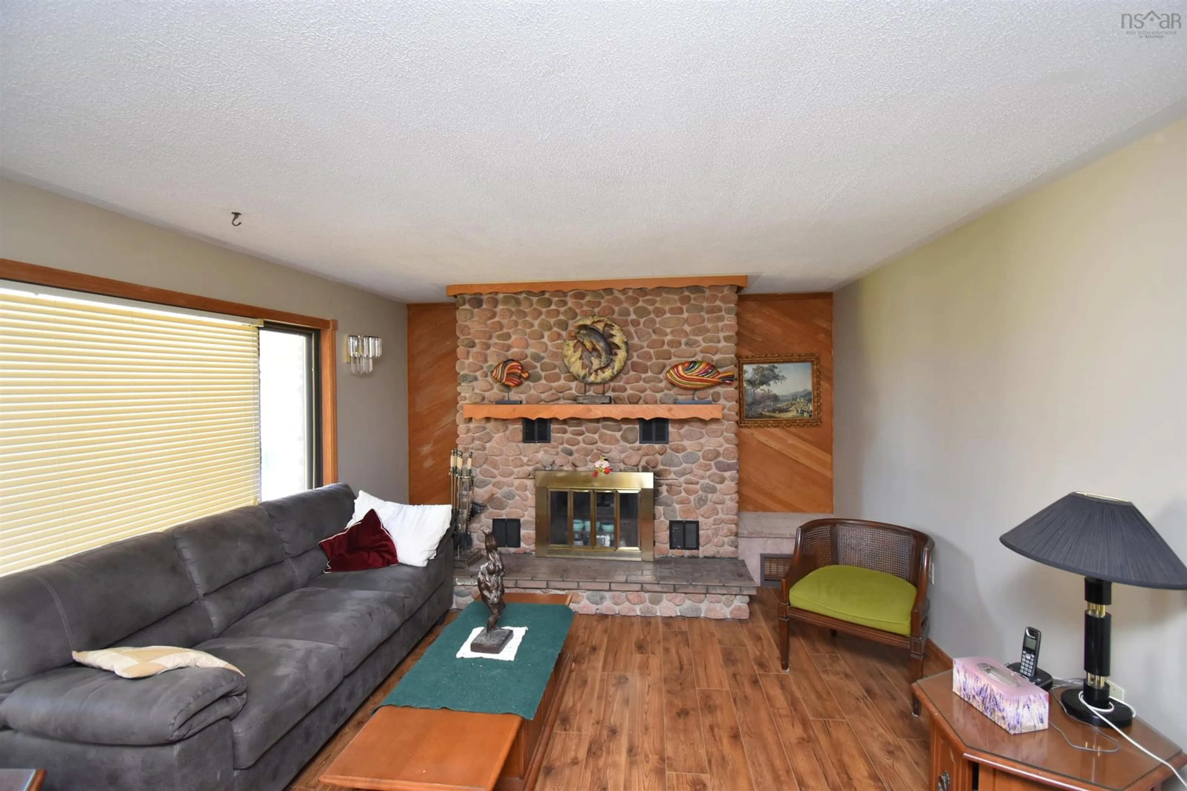 Living room with furniture, wood/laminate floor for 40 Blue Jay Pl, Valley Nova Scotia B6L 2A4