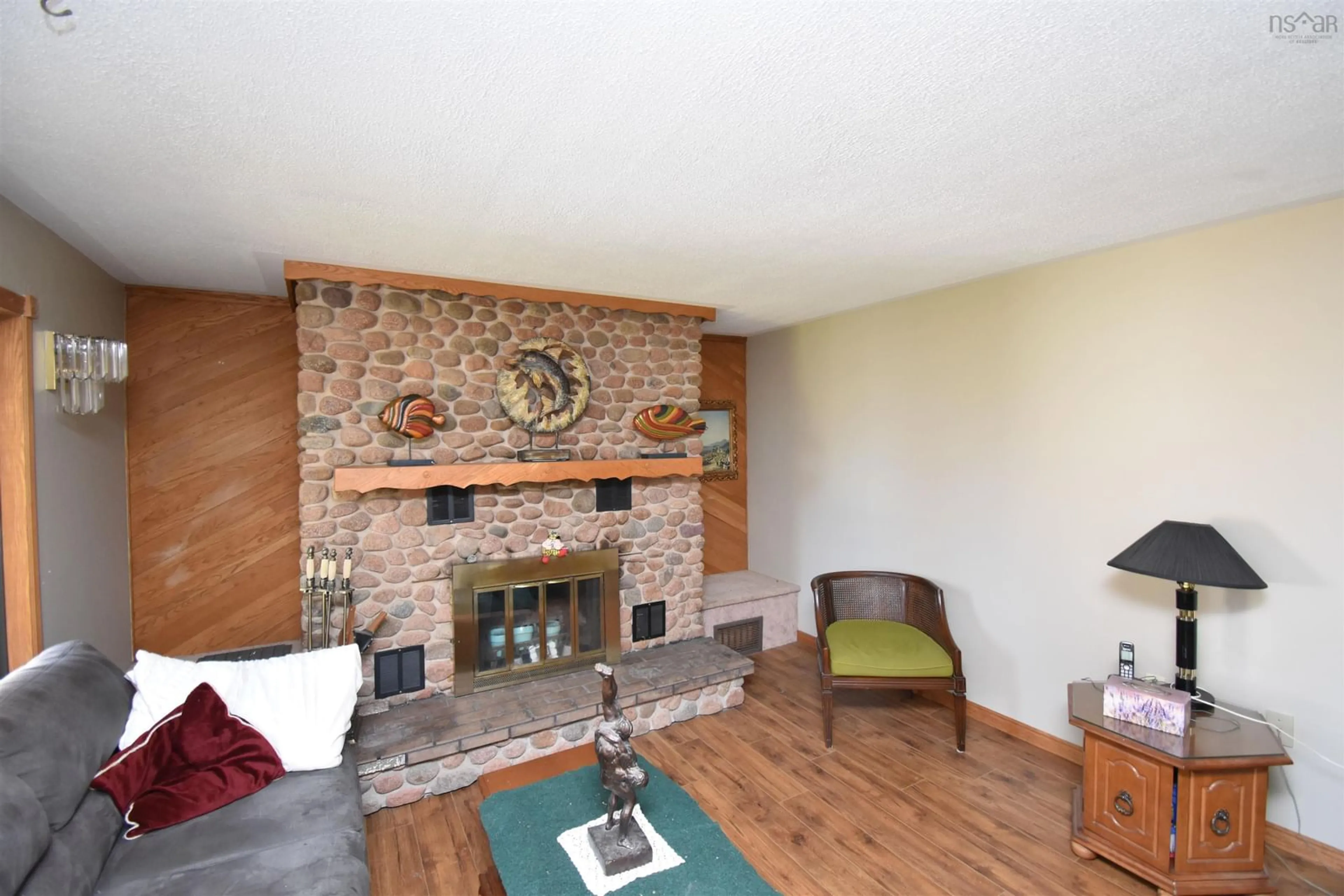 Living room with furniture, wood/laminate floor for 40 Blue Jay Pl, Valley Nova Scotia B6L 2A4