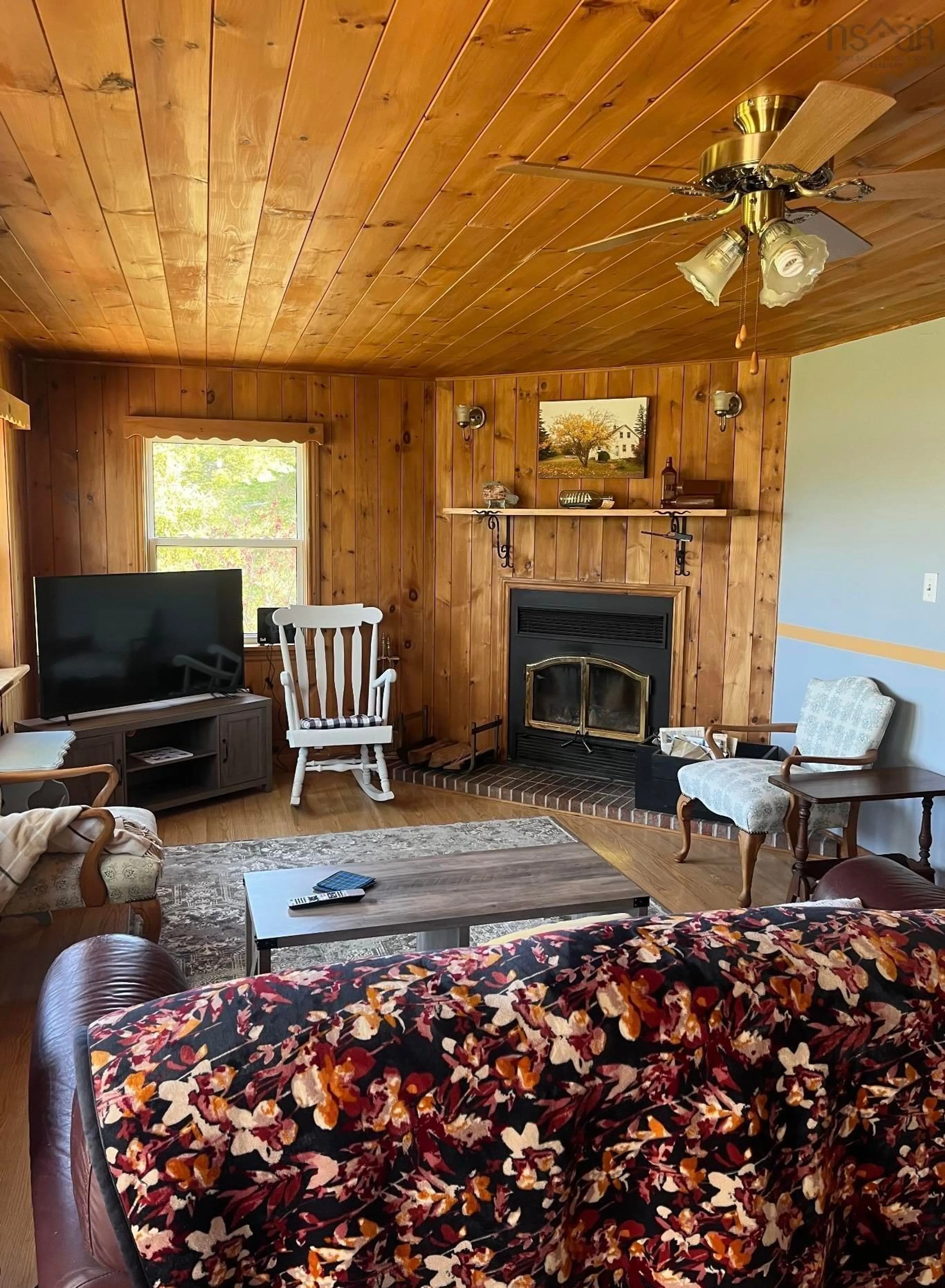 Living room with furniture, wood/laminate floor for 2099 Highway 320, Martinique Nova Scotia B0E 1K0