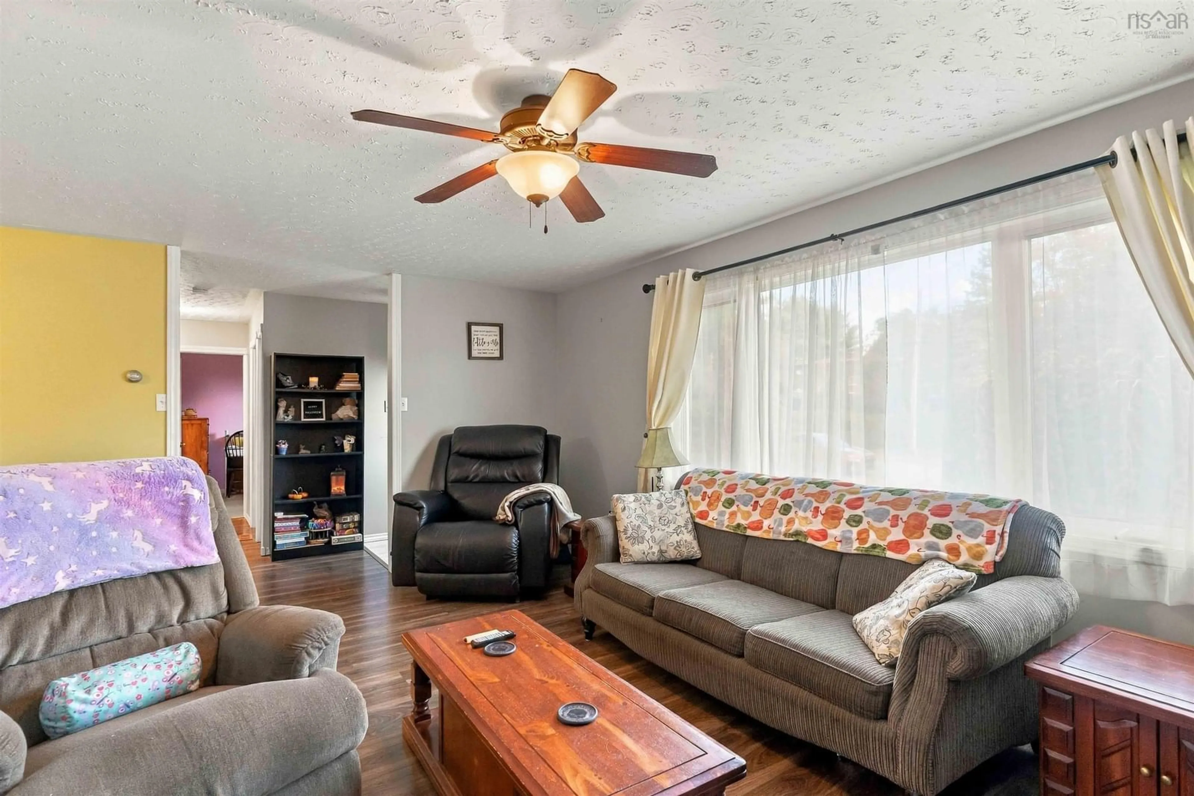 Living room with furniture, wood/laminate floor for 1130 Aalders Ave, New Minas Nova Scotia B4N 3H5