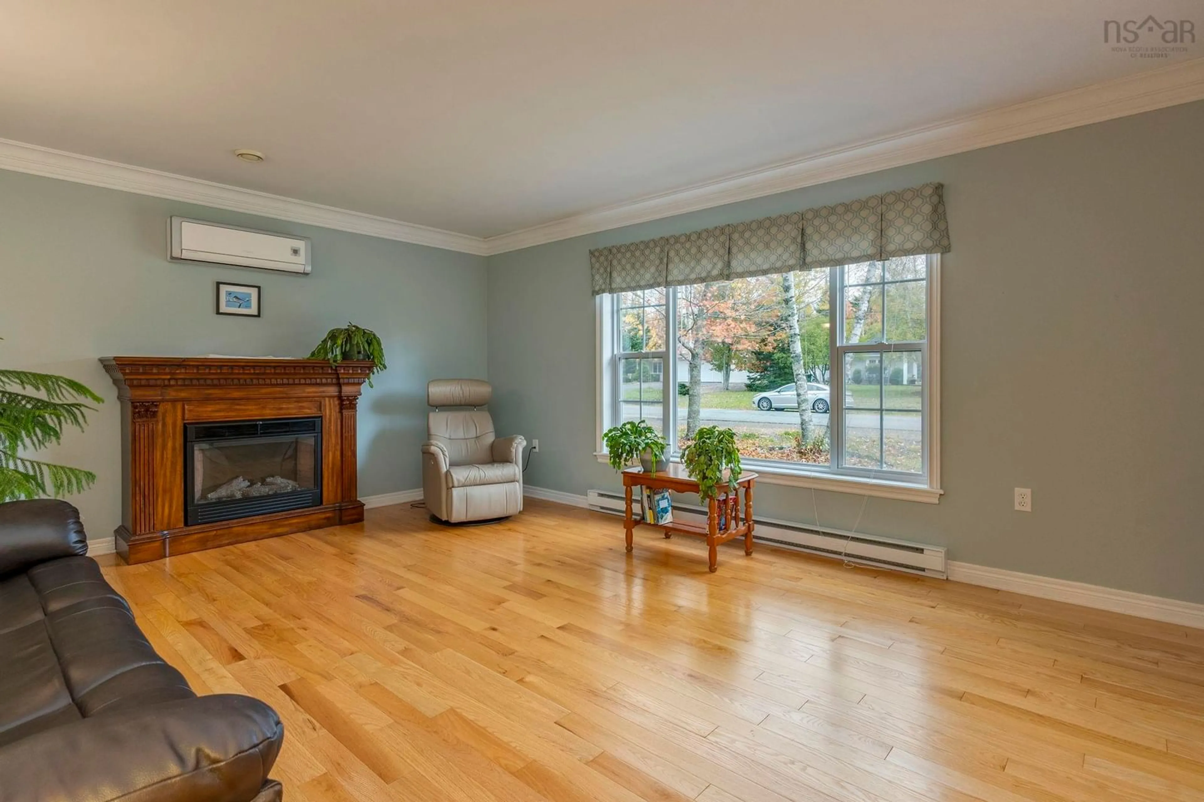 Living room with furniture, wood/laminate floor for 39 Homestead Dr, Valley Nova Scotia B6L 3S1