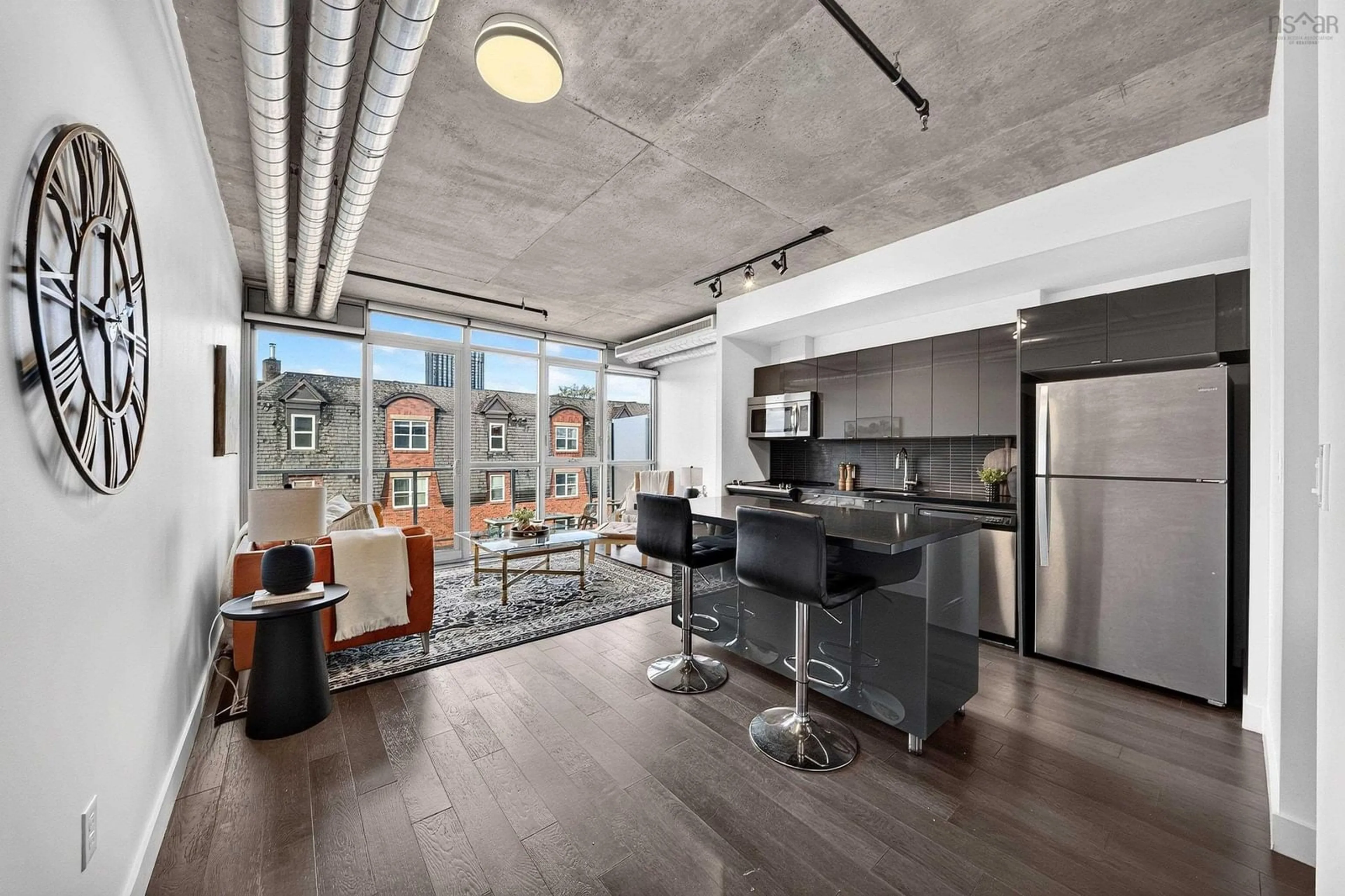 Open concept kitchen, cement floor for 1065 Barrington St #522, Halifax Nova Scotia B3H 0B7