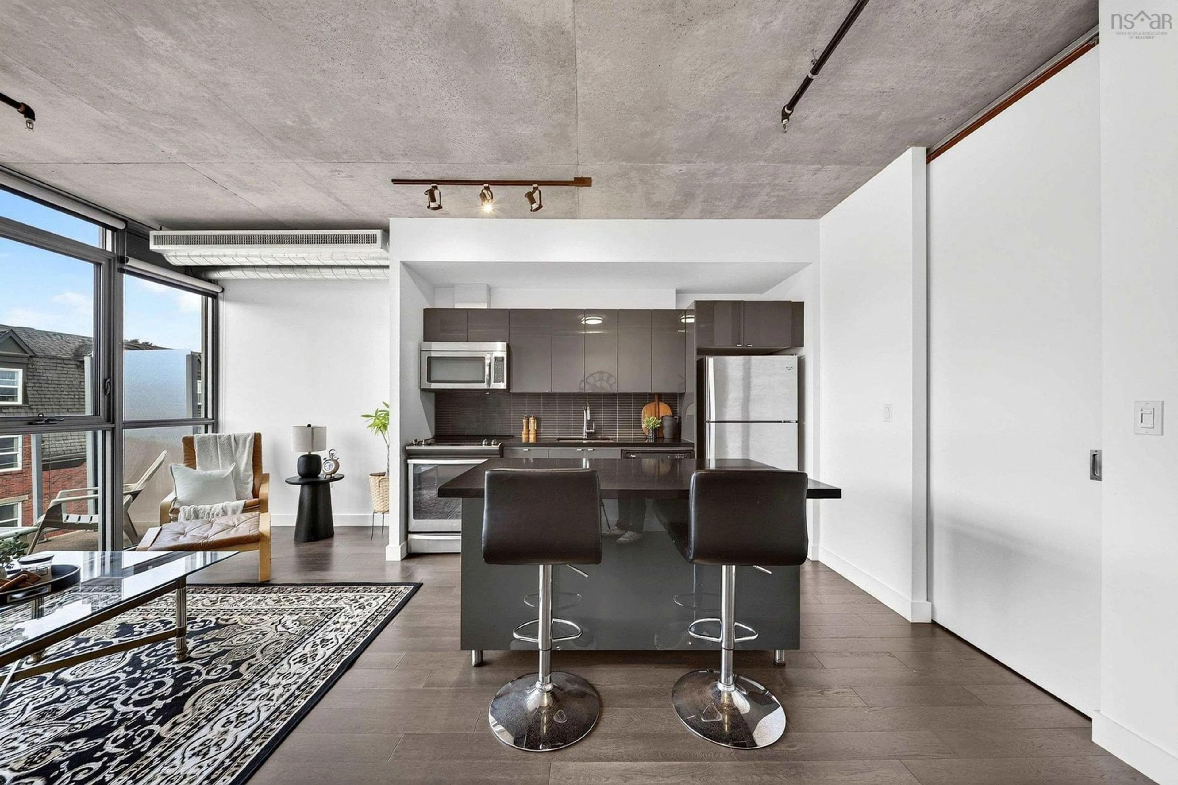 Open concept kitchen, cement floor for 1065 Barrington St #522, Halifax Nova Scotia B3H 0B7