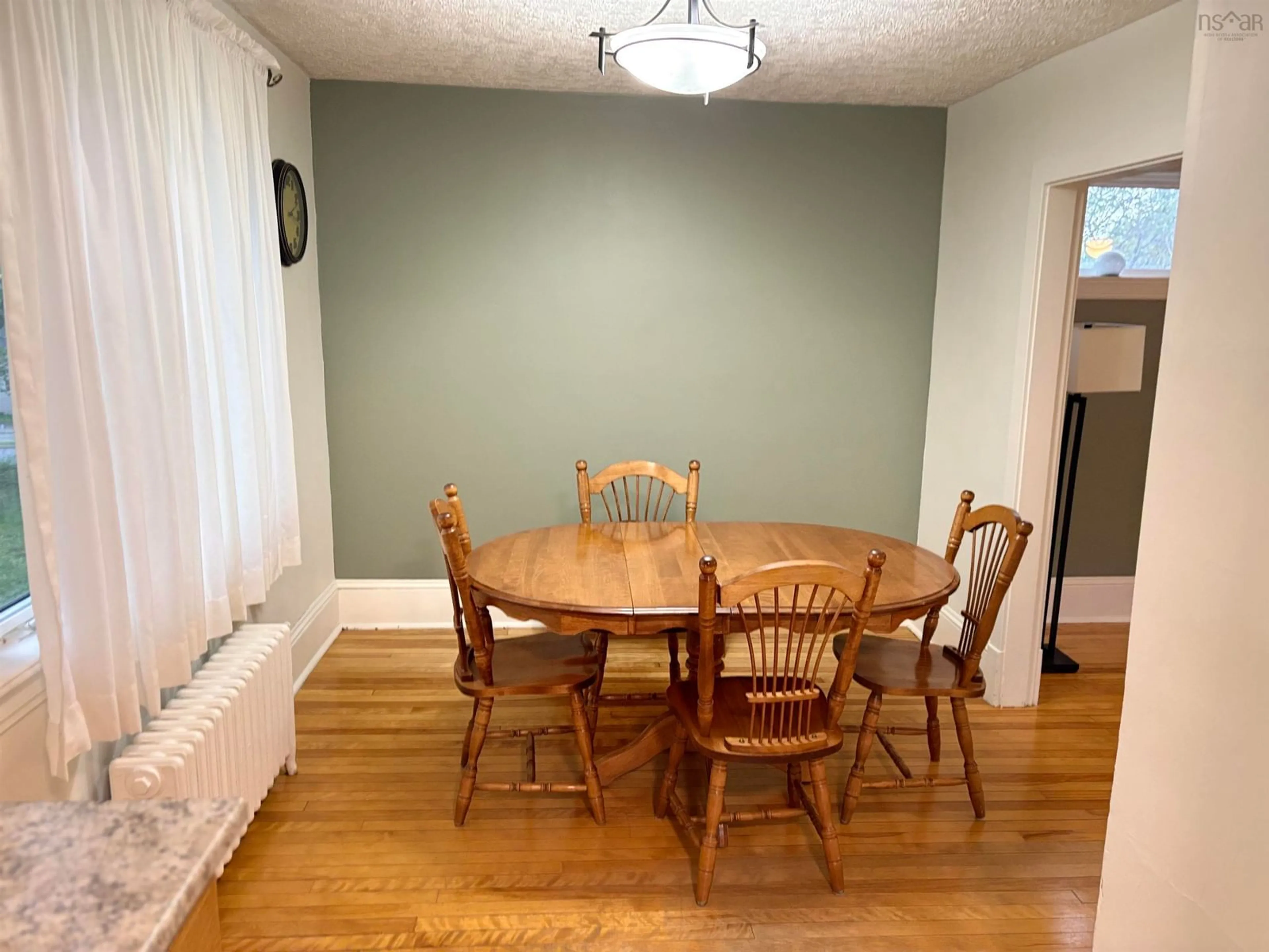 Dining room, wood/laminate floor for 23 Milton St, Sydney Nova Scotia B1P 4L6