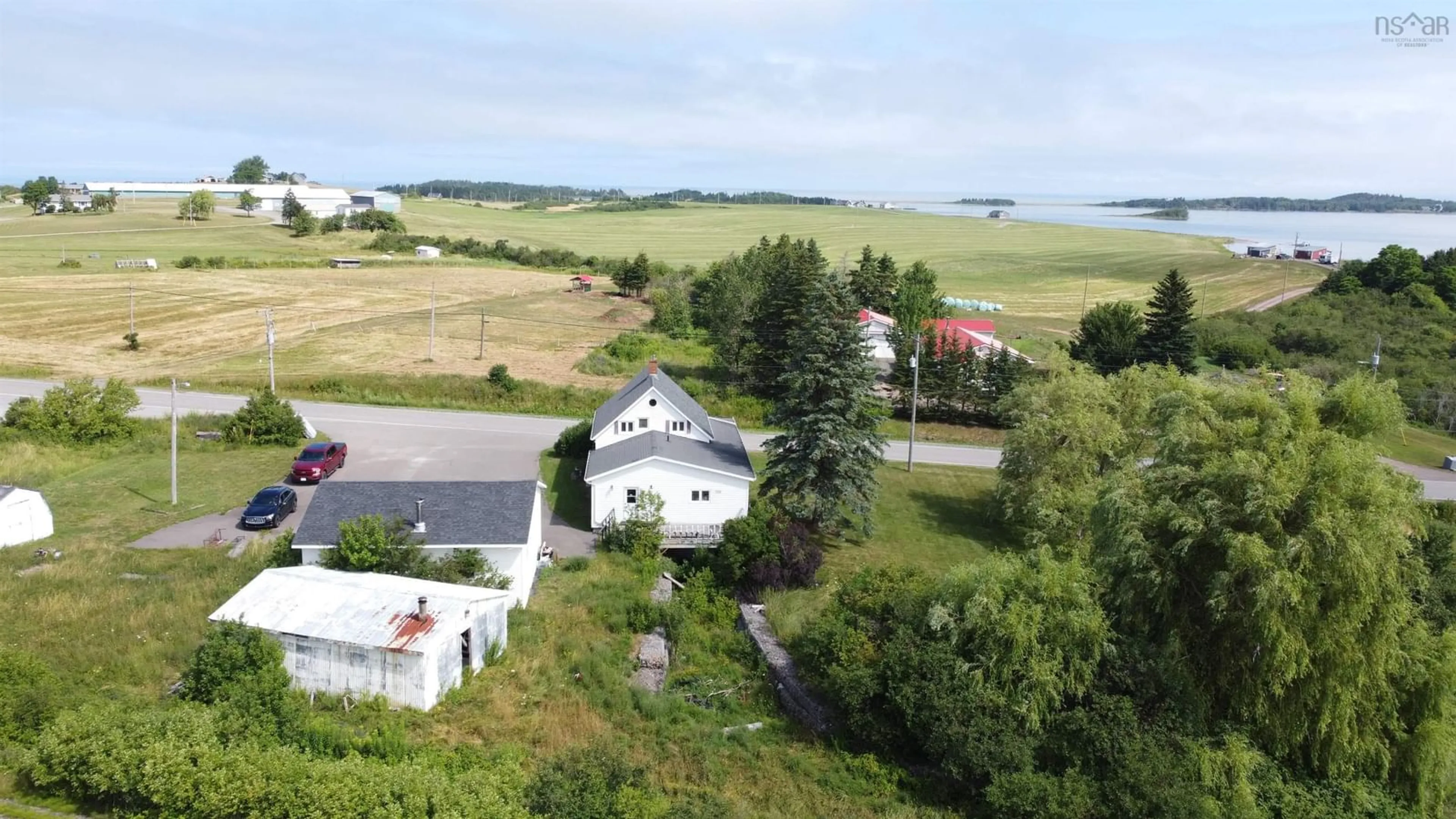 A pic from outside/outdoor area/front of a property/back of a property/a pic from drone, water/lake/river/ocean view for 9390 Highway 4, Tracadie Nova Scotia B0H 1W0