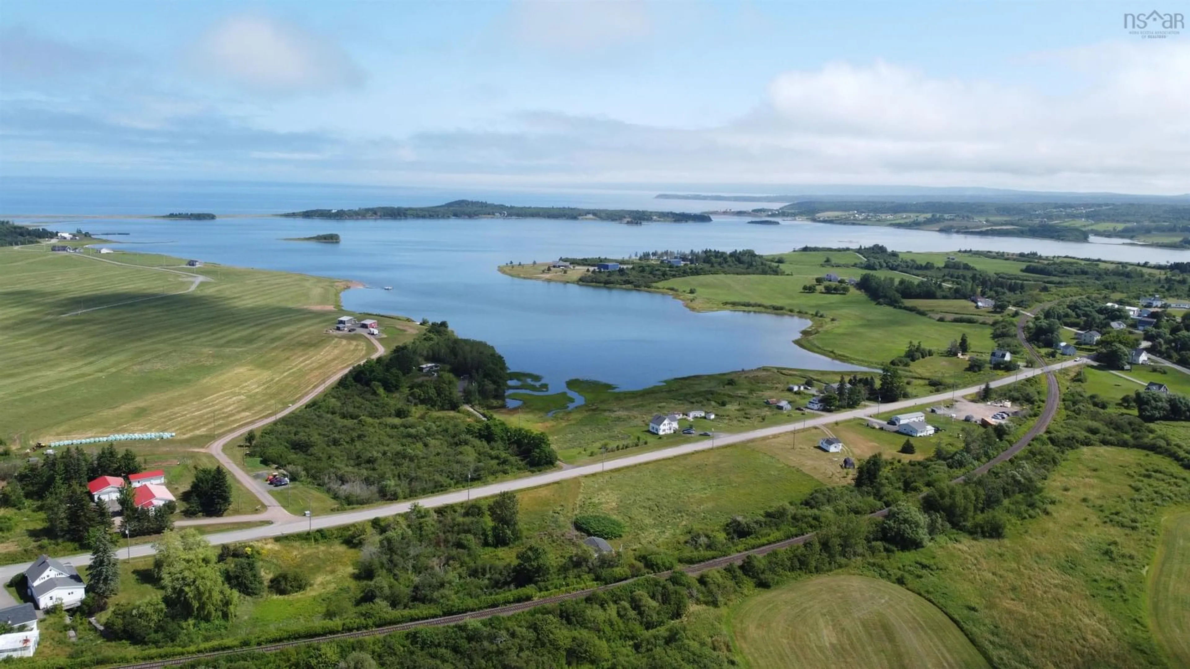 A pic from outside/outdoor area/front of a property/back of a property/a pic from drone, water/lake/river/ocean view for 9390 Highway 4, Tracadie Nova Scotia B0H 1W0