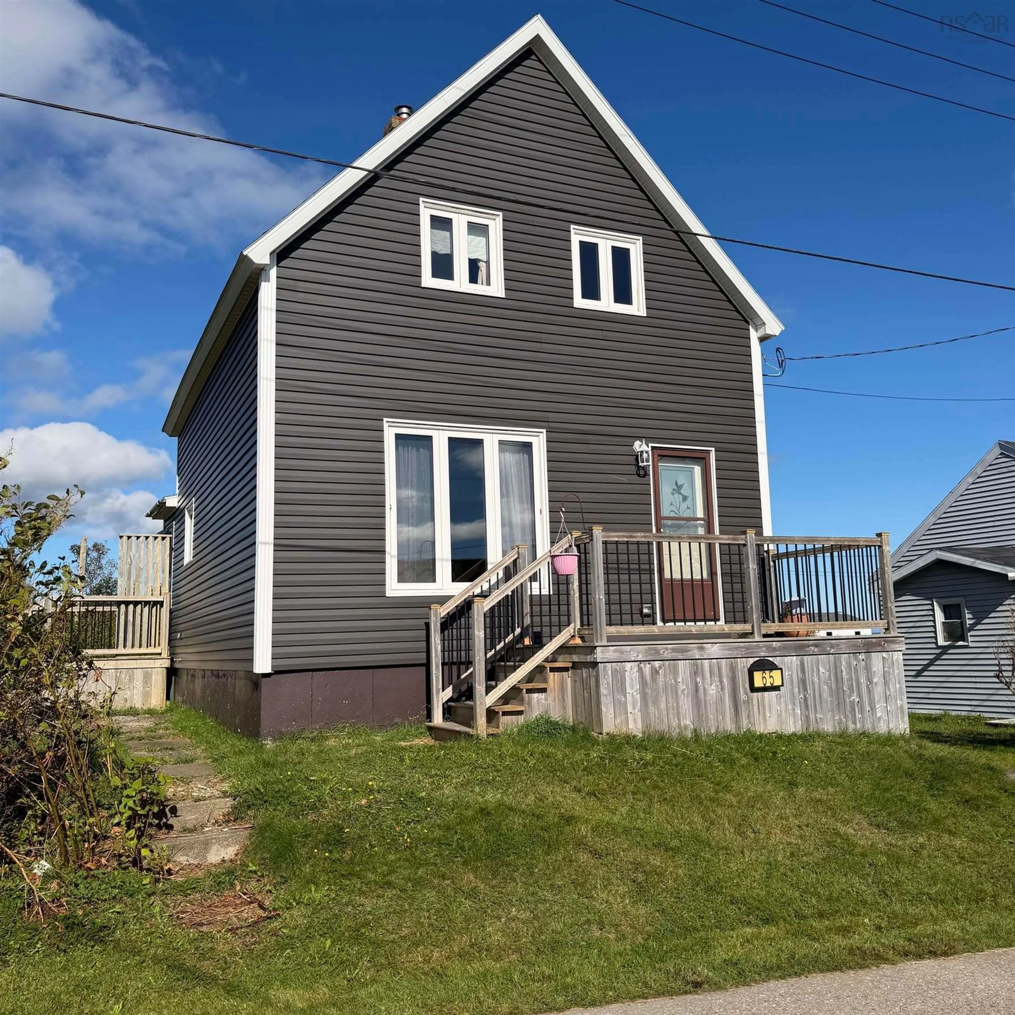 Home with vinyl exterior material, street for 65 Cliff St, Port Morien Nova Scotia B1B 1B4