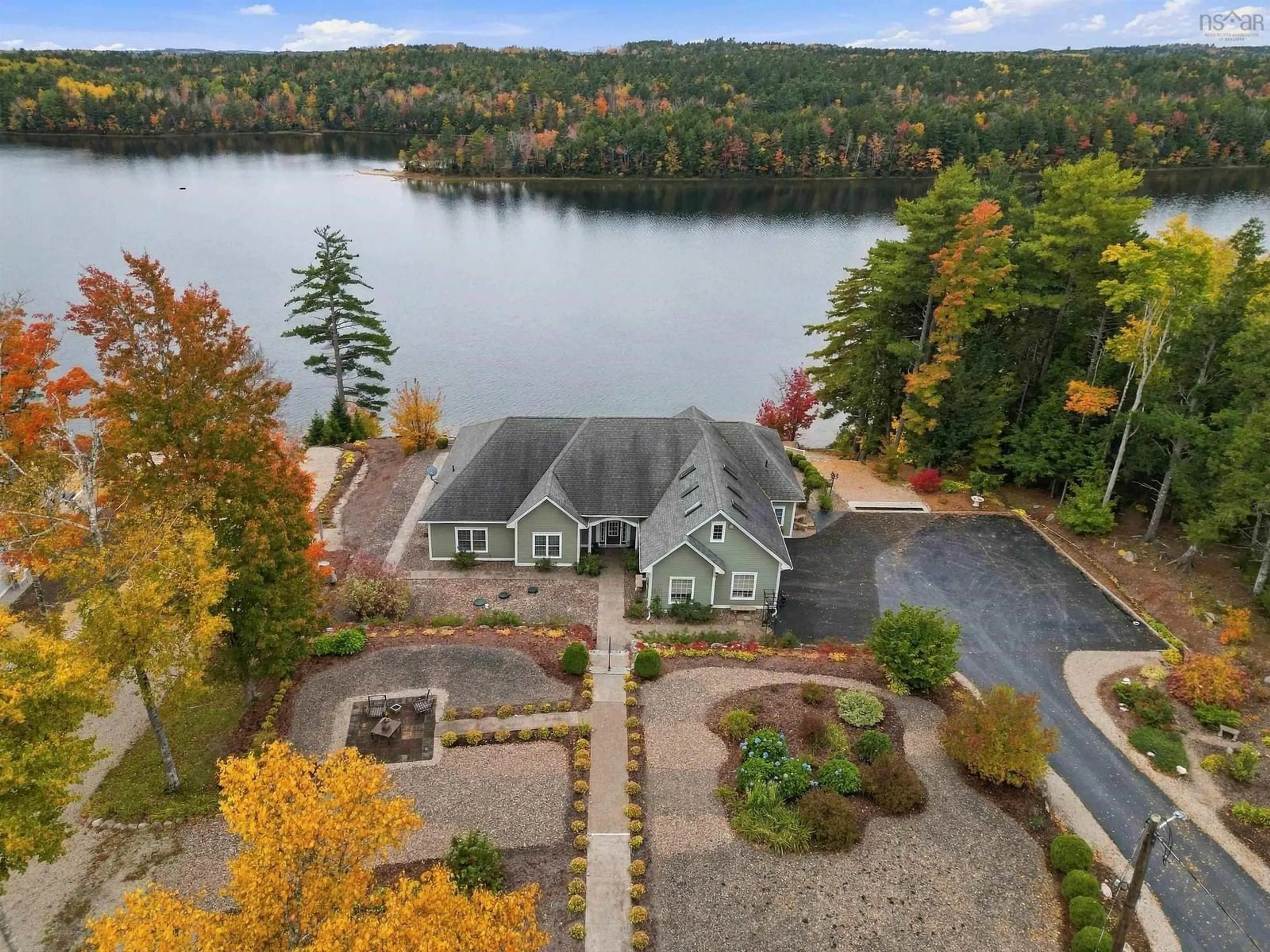 A pic from outside/outdoor area/front of a property/back of a property/a pic from drone, water/lake/river/ocean view for 409 Aulenback Point Road, Sweetland Nova Scotia B0J 1E0