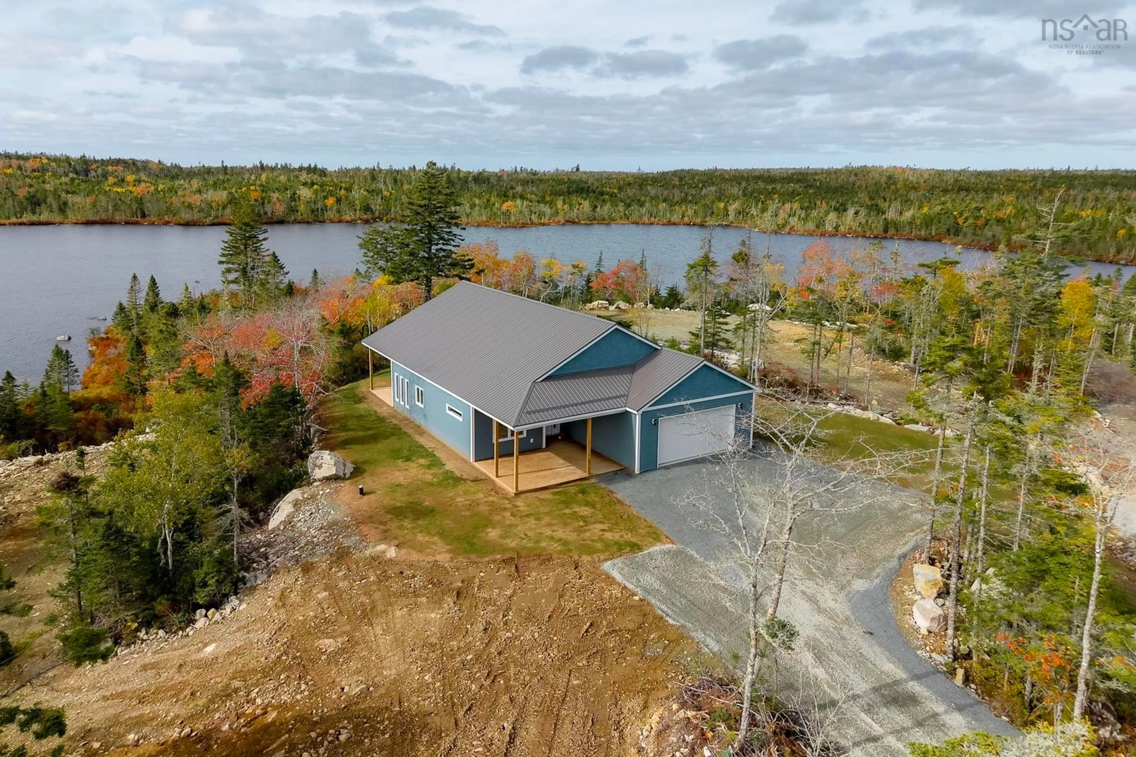 A pic from outside/outdoor area/front of a property/back of a property/a pic from drone, water/lake/river/ocean view for 100 Lakepoint Way, West Jeddore Nova Scotia B0J 1P0