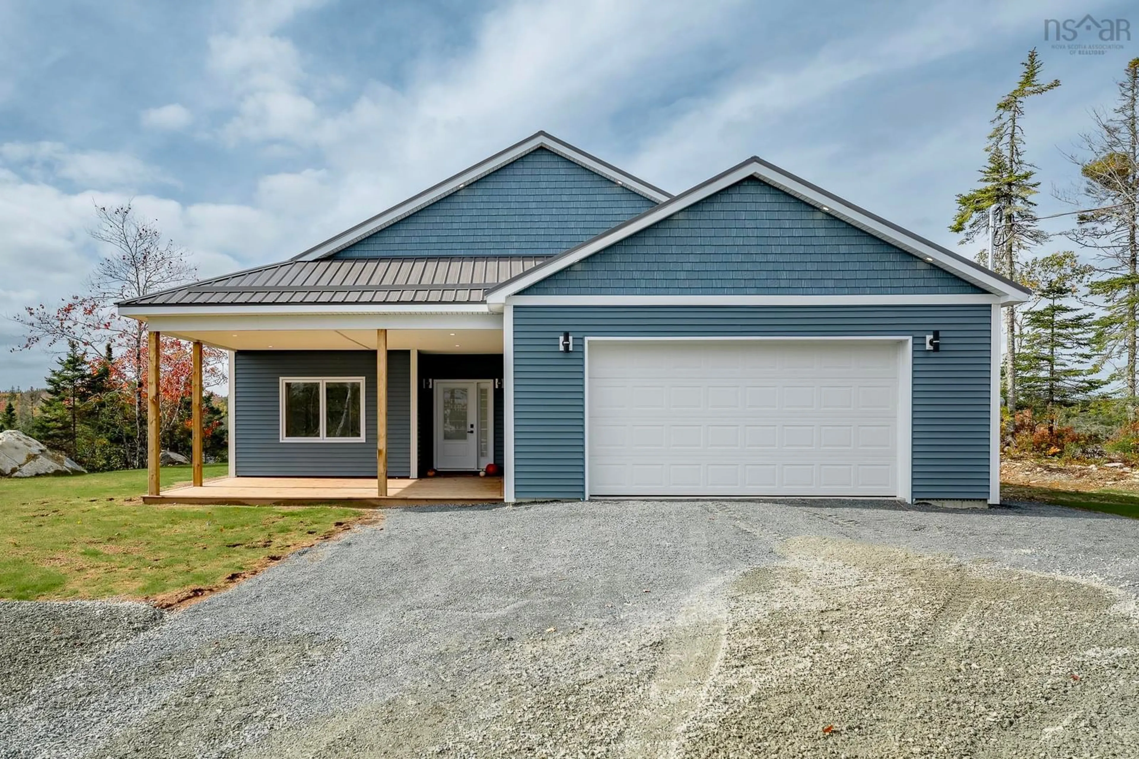 Home with vinyl exterior material, street for 100 Lakepoint Way, West Jeddore Nova Scotia B0J 1P0