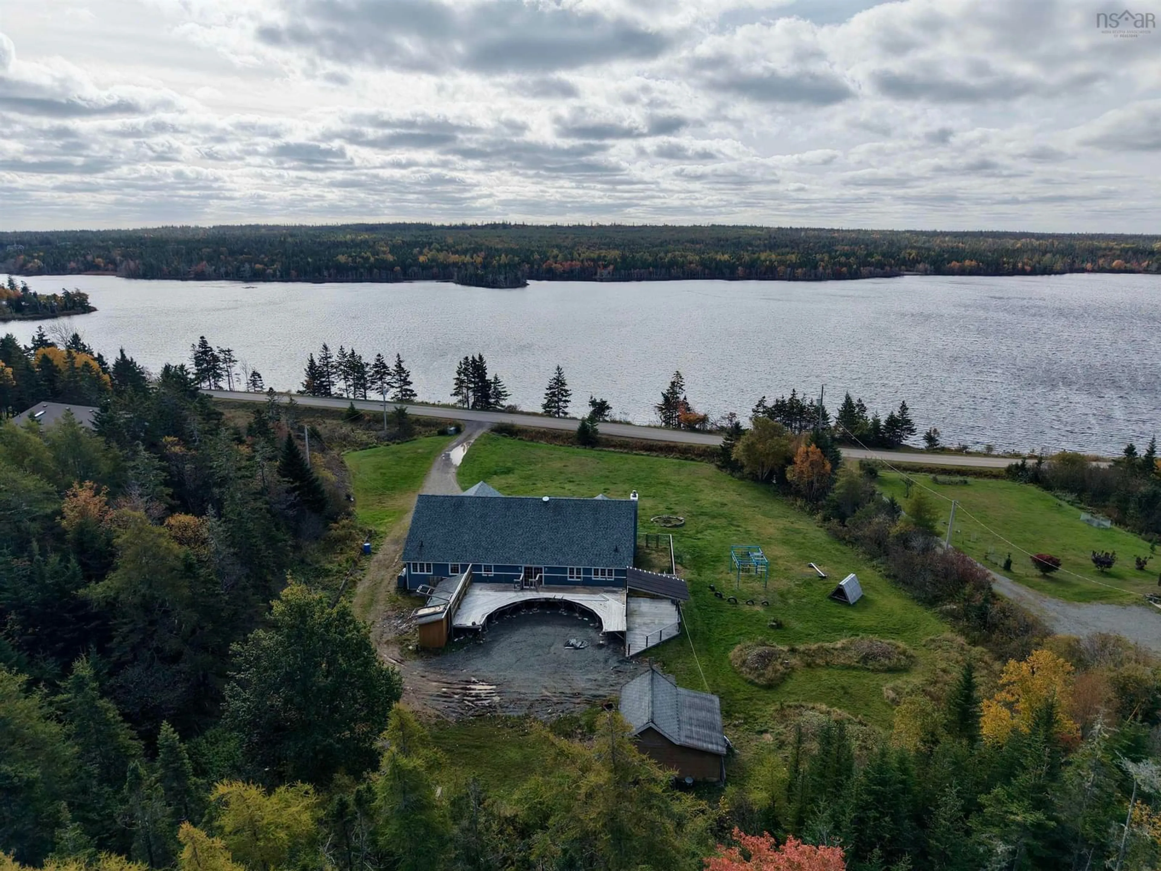 A pic from outside/outdoor area/front of a property/back of a property/a pic from drone, water/lake/river/ocean view for 333 Lochside Rd., Arichat Nova Scotia B0E 1A0