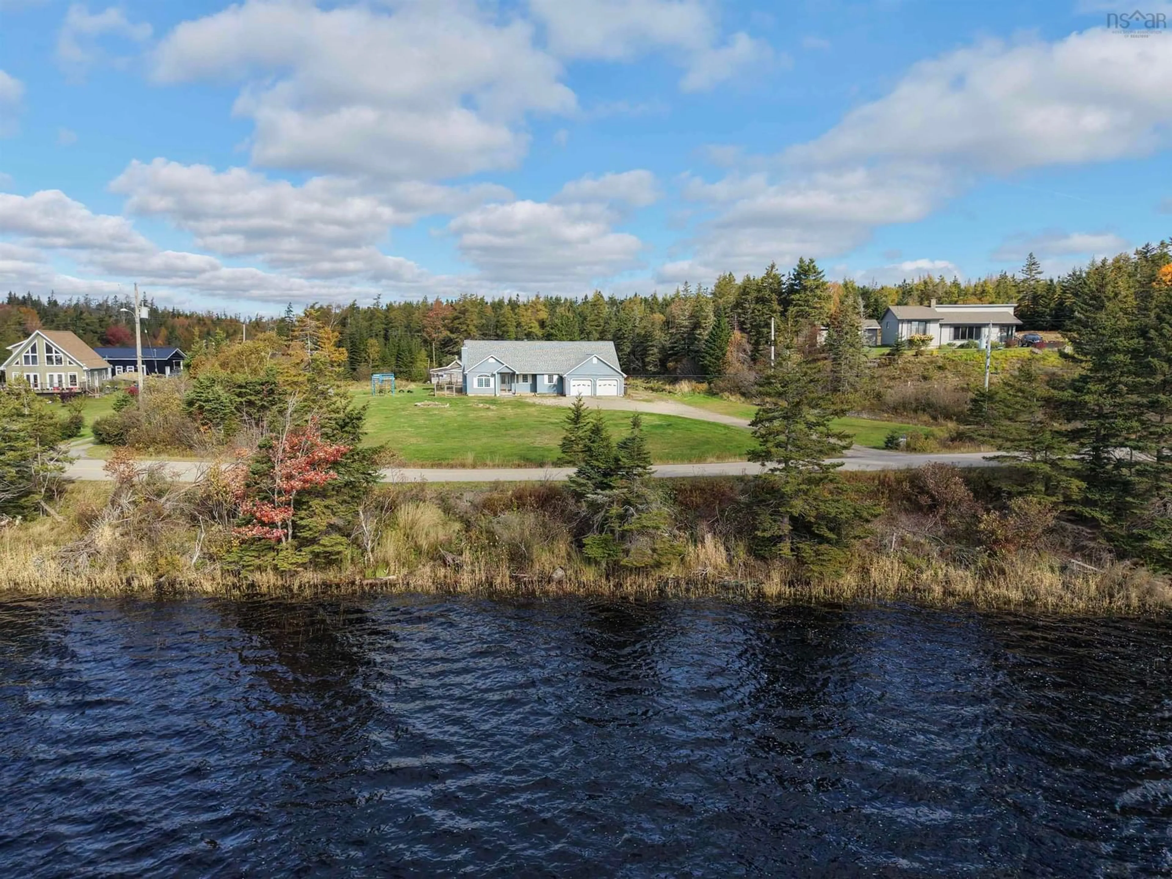 A pic from outside/outdoor area/front of a property/back of a property/a pic from drone, water/lake/river/ocean view for 333 Lochside Rd., Arichat Nova Scotia B0E 1A0