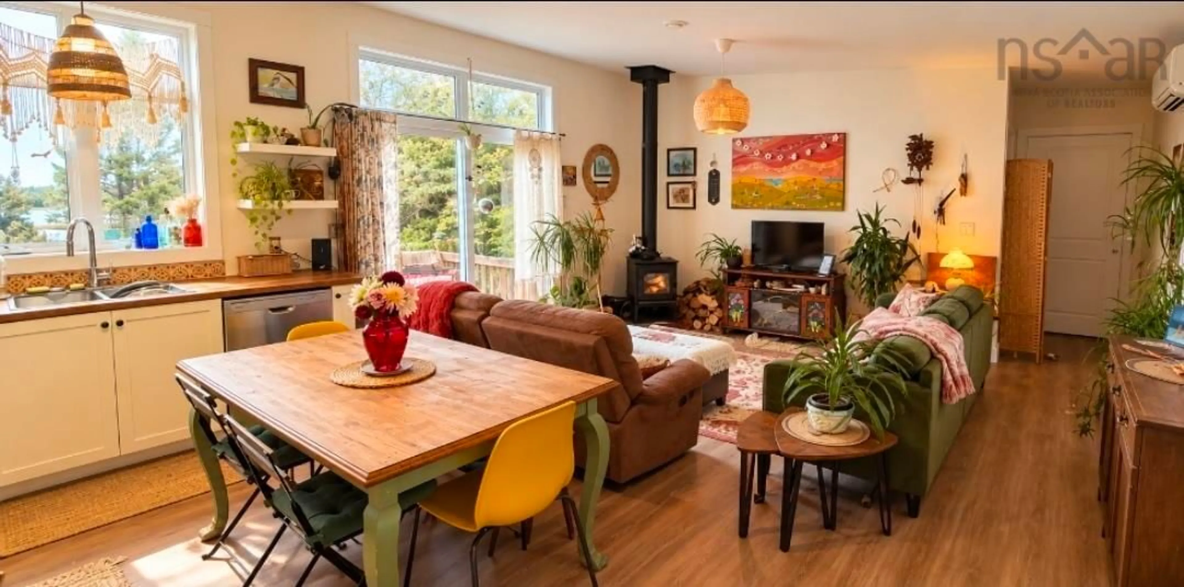 Living room with furniture, wood/laminate floor for 938 East Chezzetcook Rd, East Chezzetcook Nova Scotia B0J 2L0