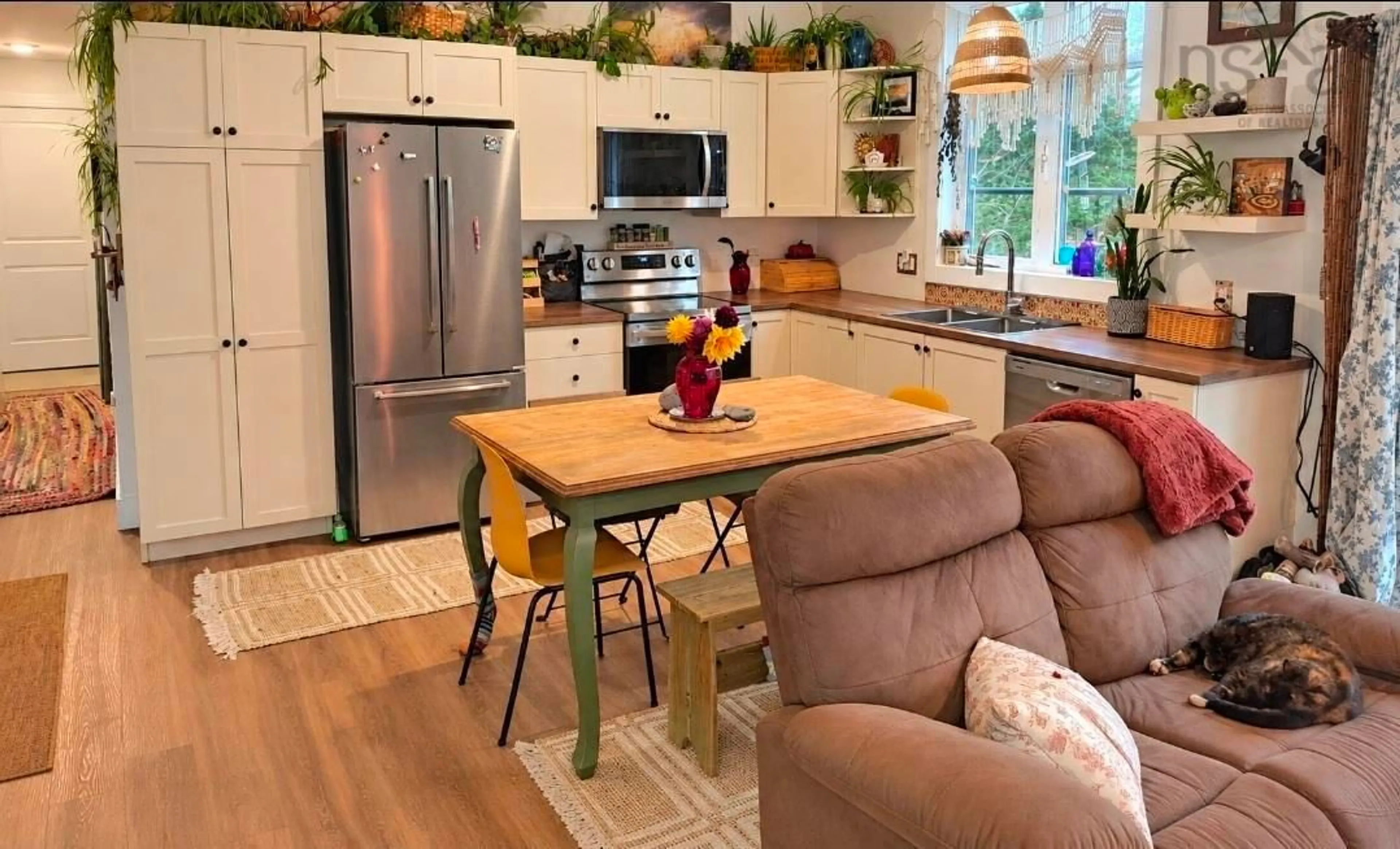 Open concept kitchen, wood/laminate floor for 938 East Chezzetcook Rd, East Chezzetcook Nova Scotia B0J 2L0
