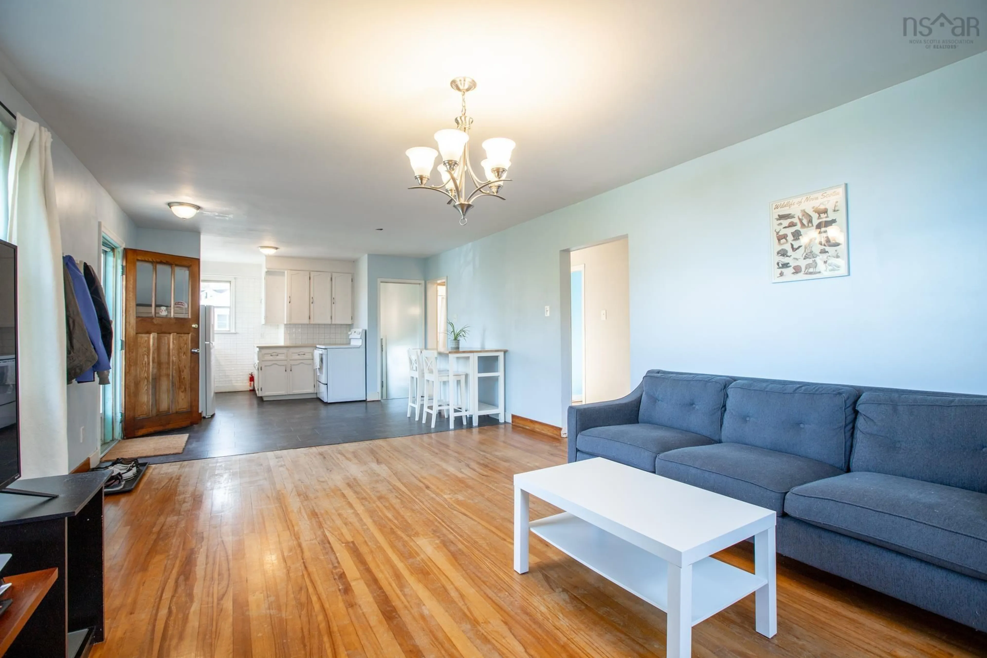 Living room with furniture, wood/laminate floor for 16 Juniper Cres, Spryfield Nova Scotia B3R 2H4