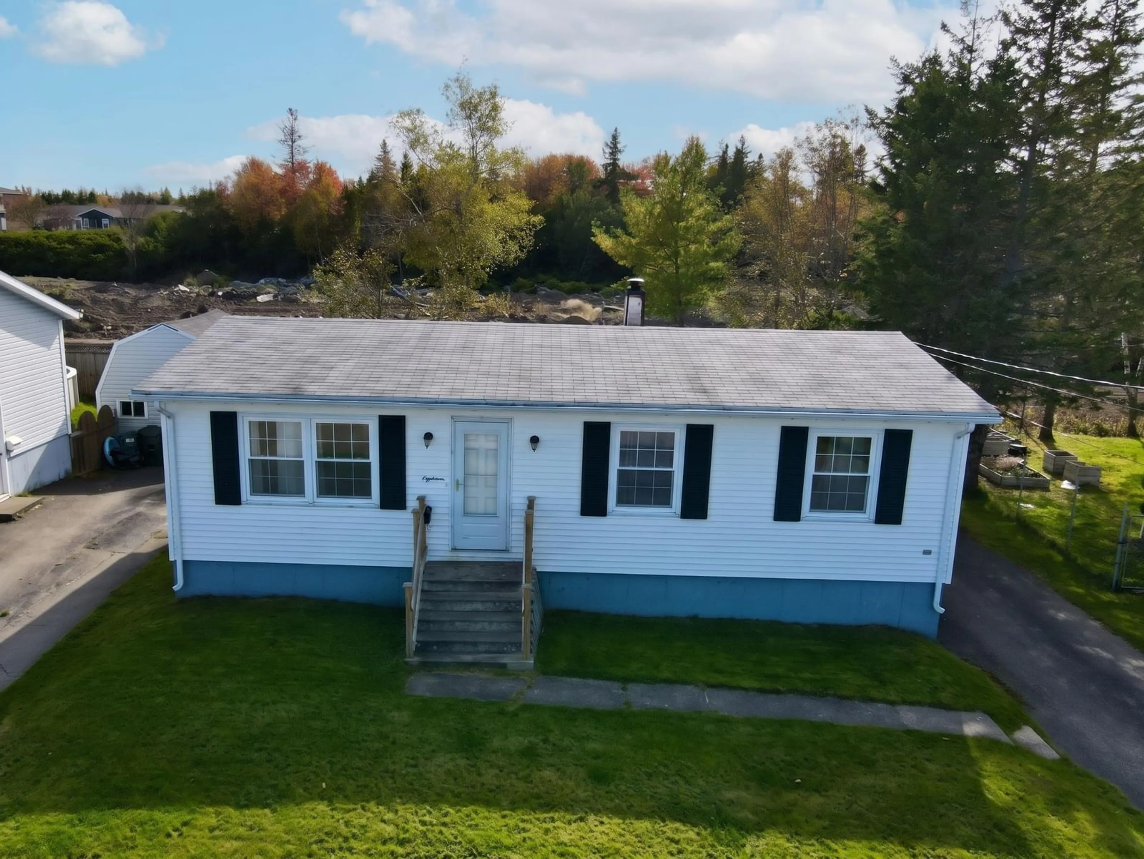 A pic from outside/outdoor area/front of a property/back of a property/a pic from drone, street for 18 Laben Dr, Sydney Nova Scotia B1S 3A5
