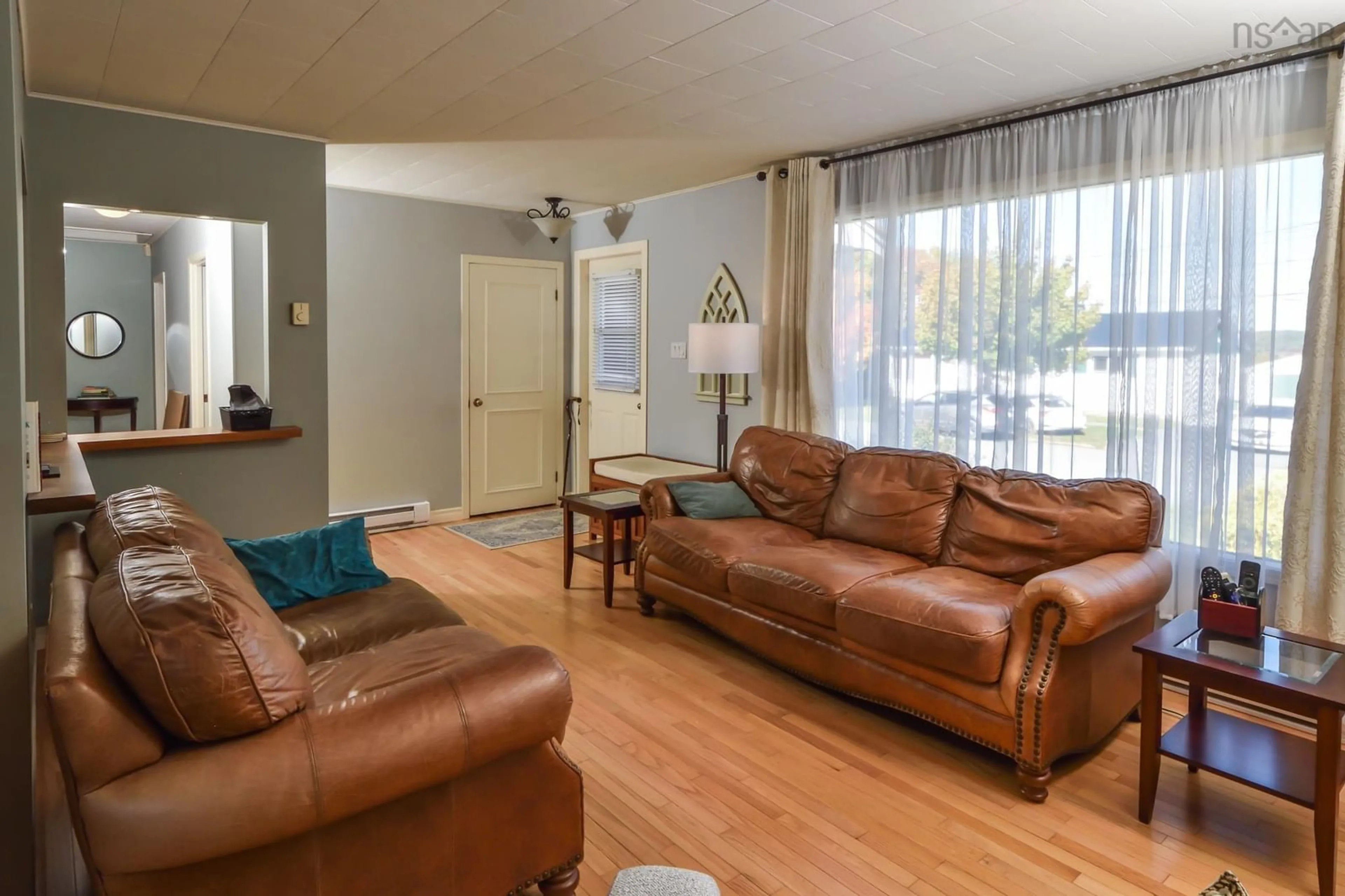 Living room with furniture, wood/laminate floor for 73 Forest Hill Rd, Bridgewater Nova Scotia B4V 1V2