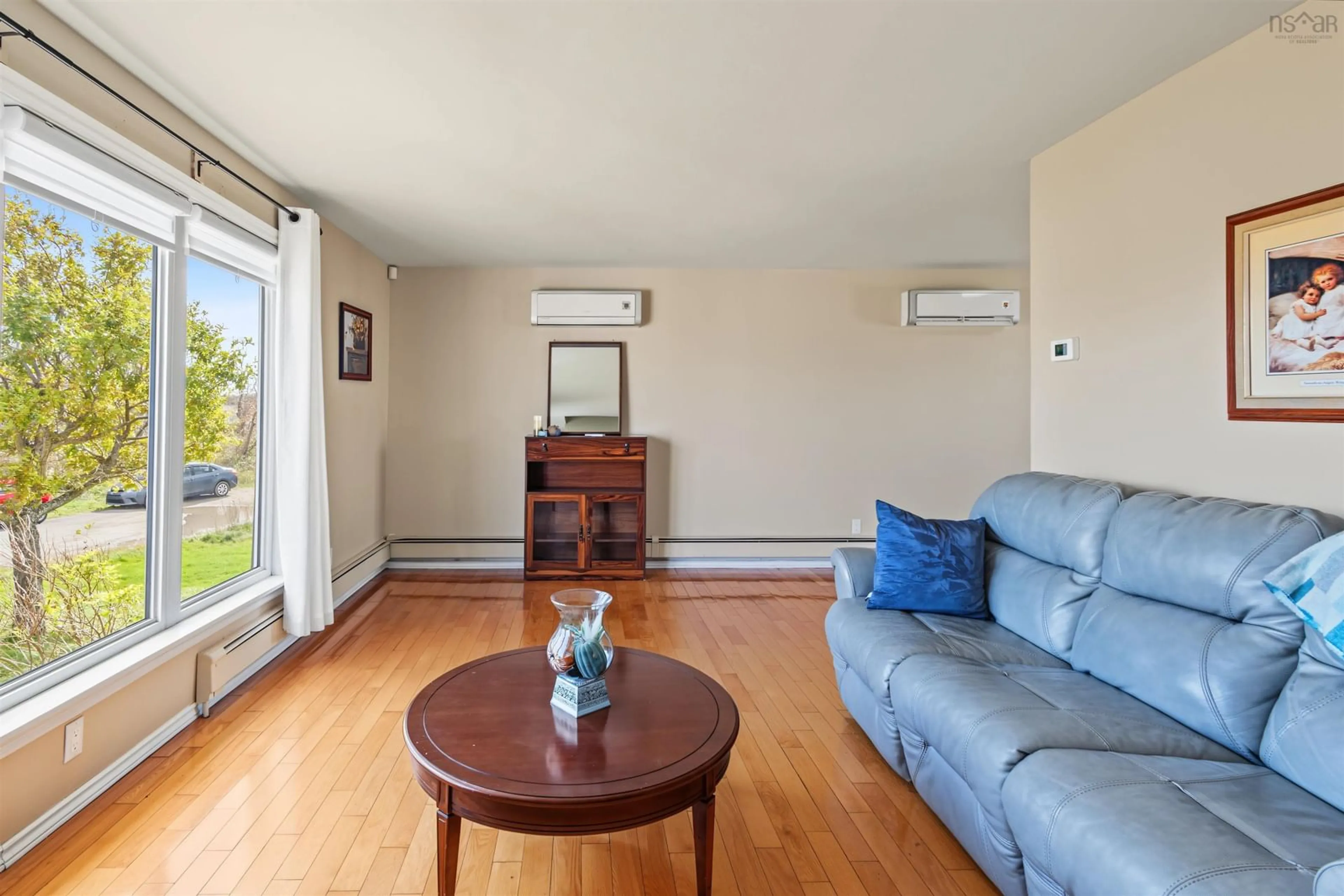 Living room with furniture, wood/laminate floor for 3 Churchill St, Glace Bay Nova Scotia B1A 4N1