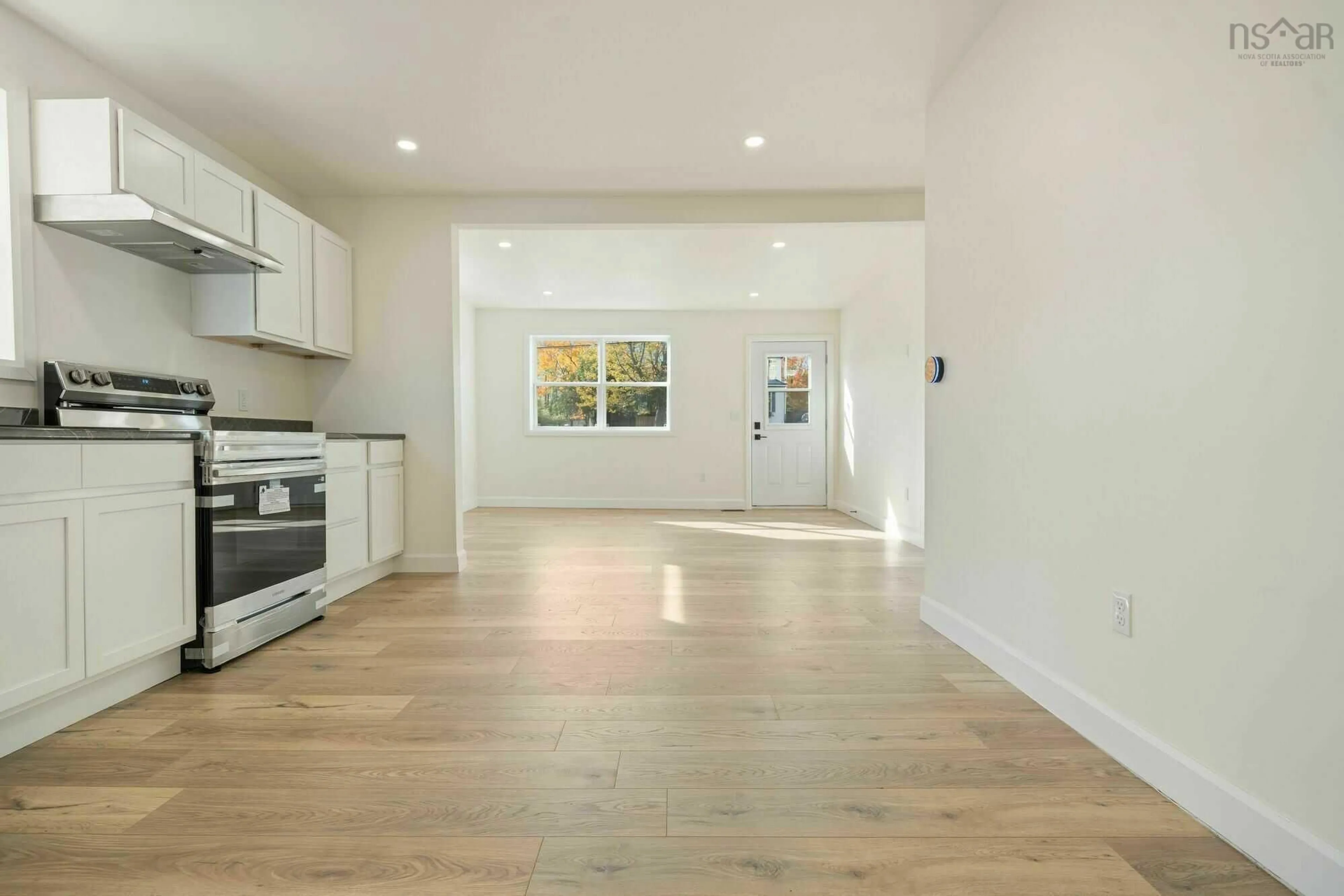 Open concept kitchen, wood/laminate floor for 162 Sixth St, New Glasgow Nova Scotia B2H 1B5
