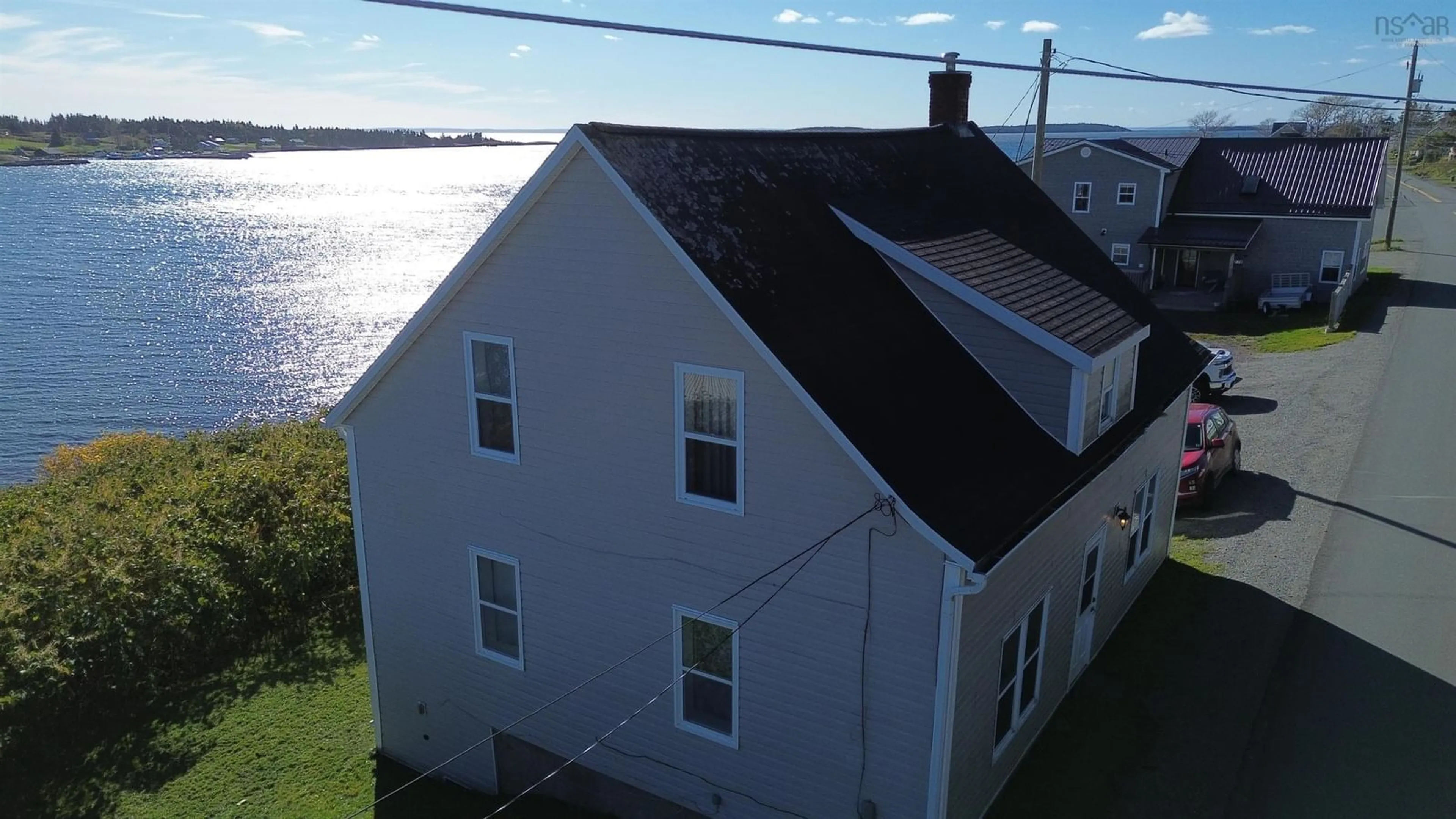 A pic from outside/outdoor area/front of a property/back of a property/a pic from drone, water/lake/river/ocean view for 788 Veterans Memorial Drive, Arichat Nova Scotia B0E 1A0