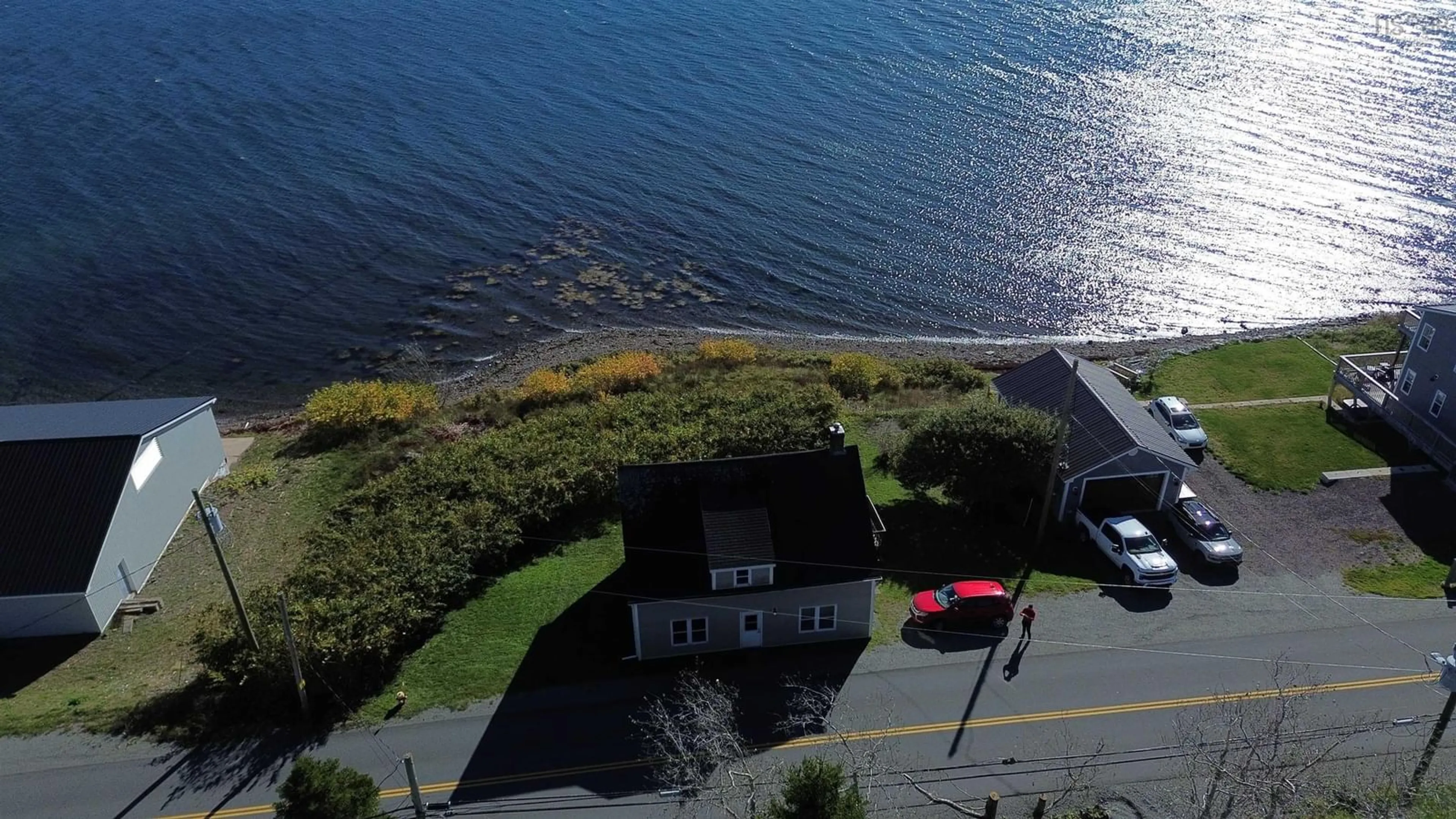 A pic from outside/outdoor area/front of a property/back of a property/a pic from drone, water/lake/river/ocean view for 788 Veterans Memorial Drive, Arichat Nova Scotia B0E 1A0