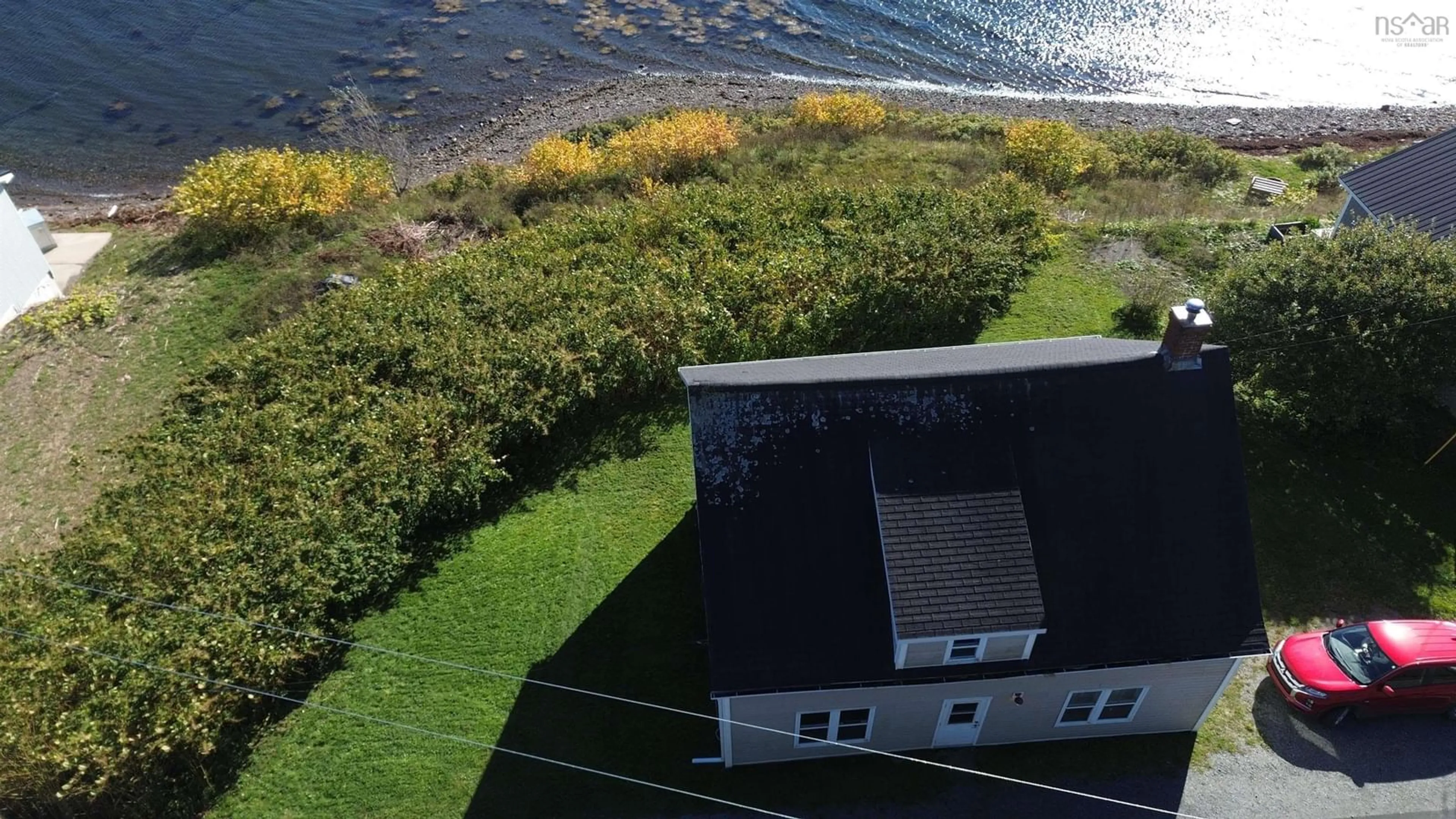 A pic from outside/outdoor area/front of a property/back of a property/a pic from drone, water/lake/river/ocean view for 788 Veterans Memorial Drive, Arichat Nova Scotia B0E 1A0