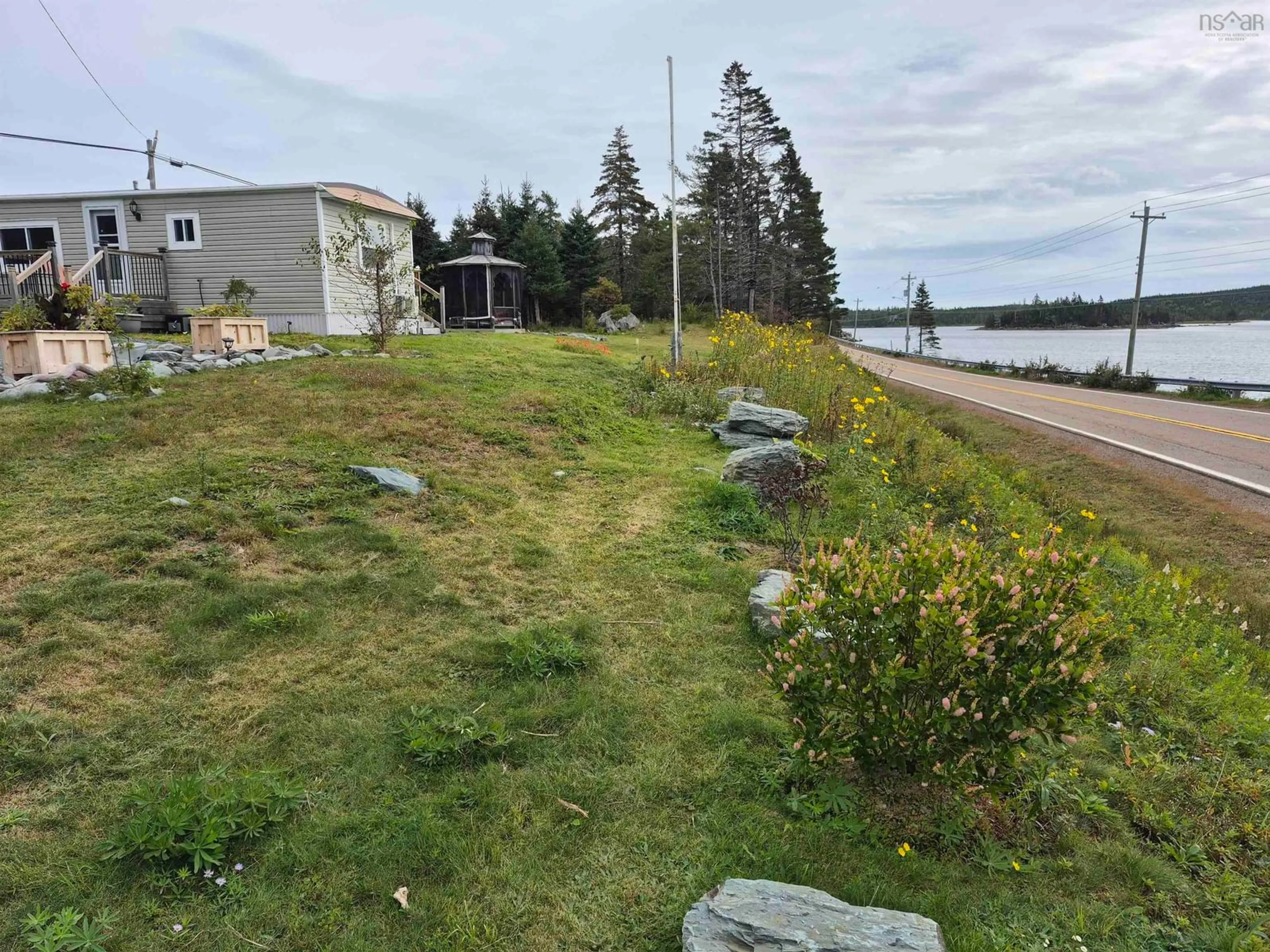 A pic from outside/outdoor area/front of a property/back of a property/a pic from drone, water/lake/river/ocean view for 4639 Highway 7, Spanish Ship Bay Nova Scotia B0J 2A0