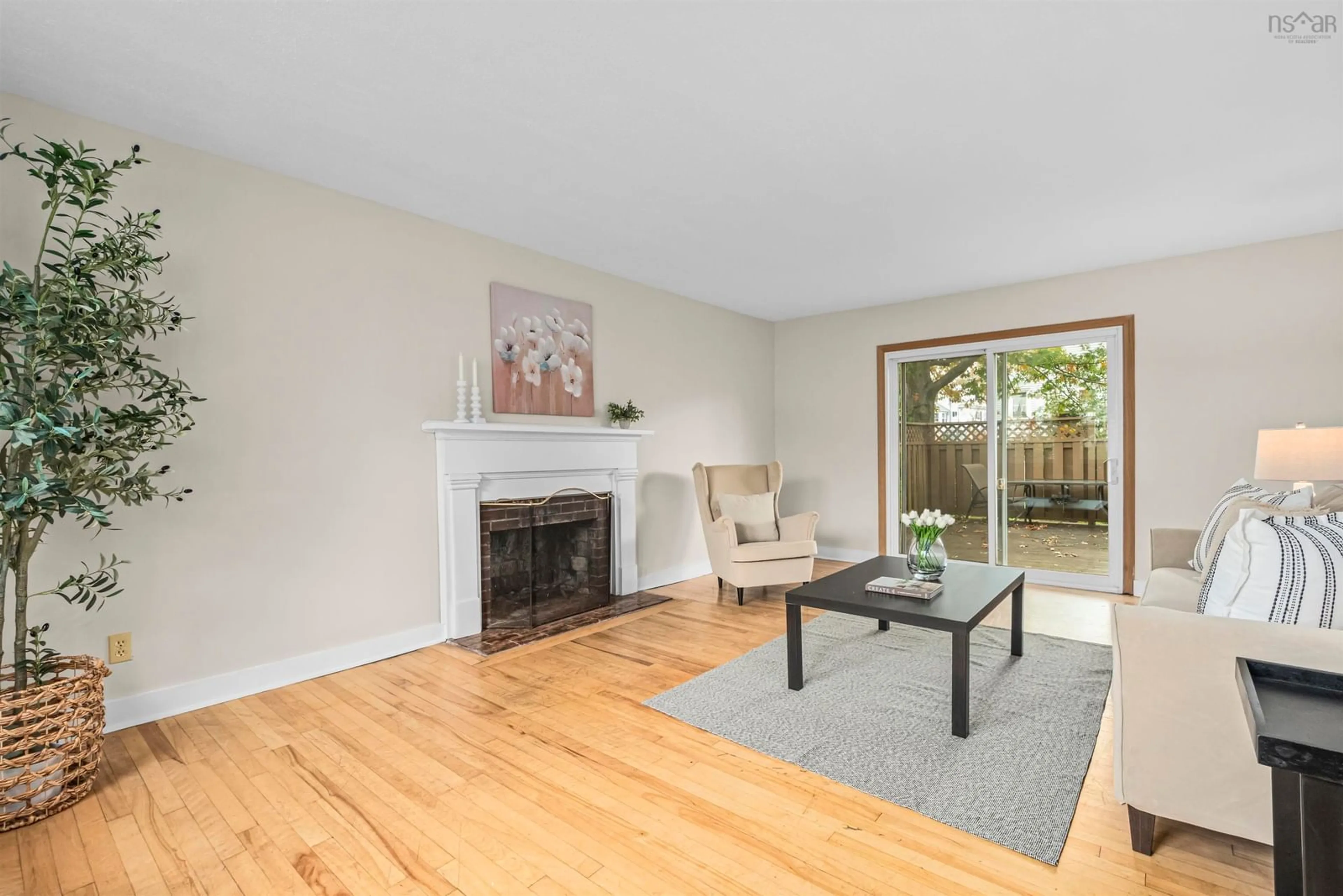 Living room with furniture, wood/laminate floor for 3176 Hemlock St, Halifax Nova Scotia B3L 4B6