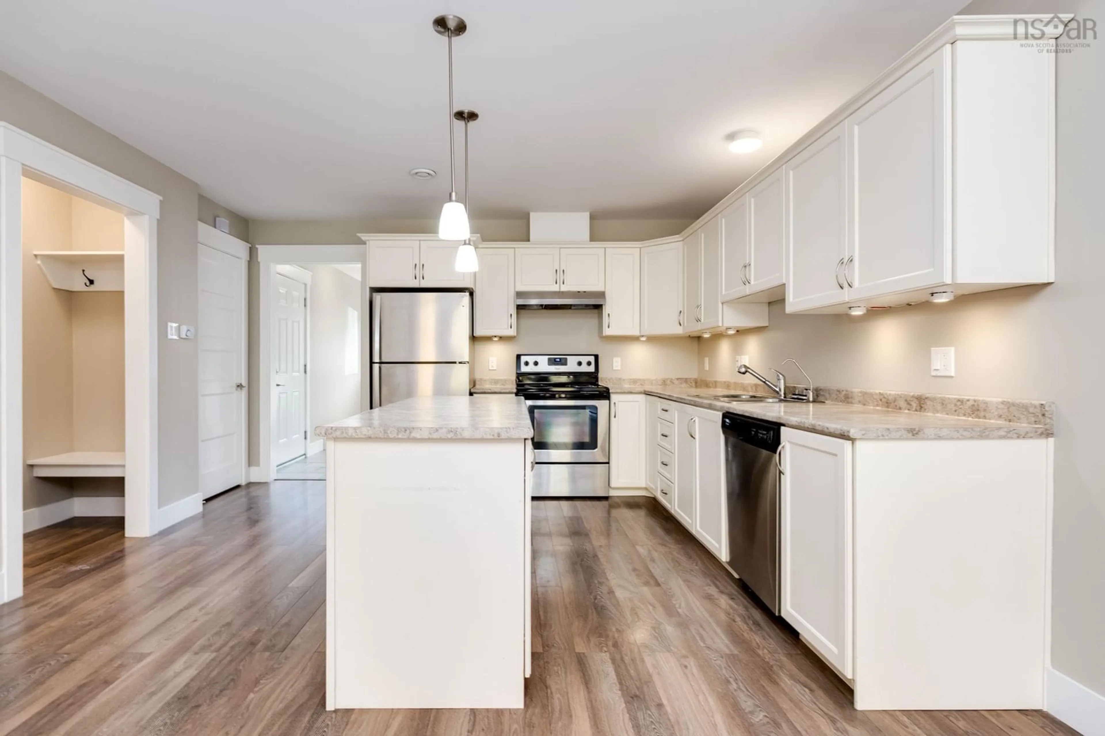Open concept kitchen, wood/laminate floor for 50 Founders Crt, Porters Lake Nova Scotia B3E 0C3