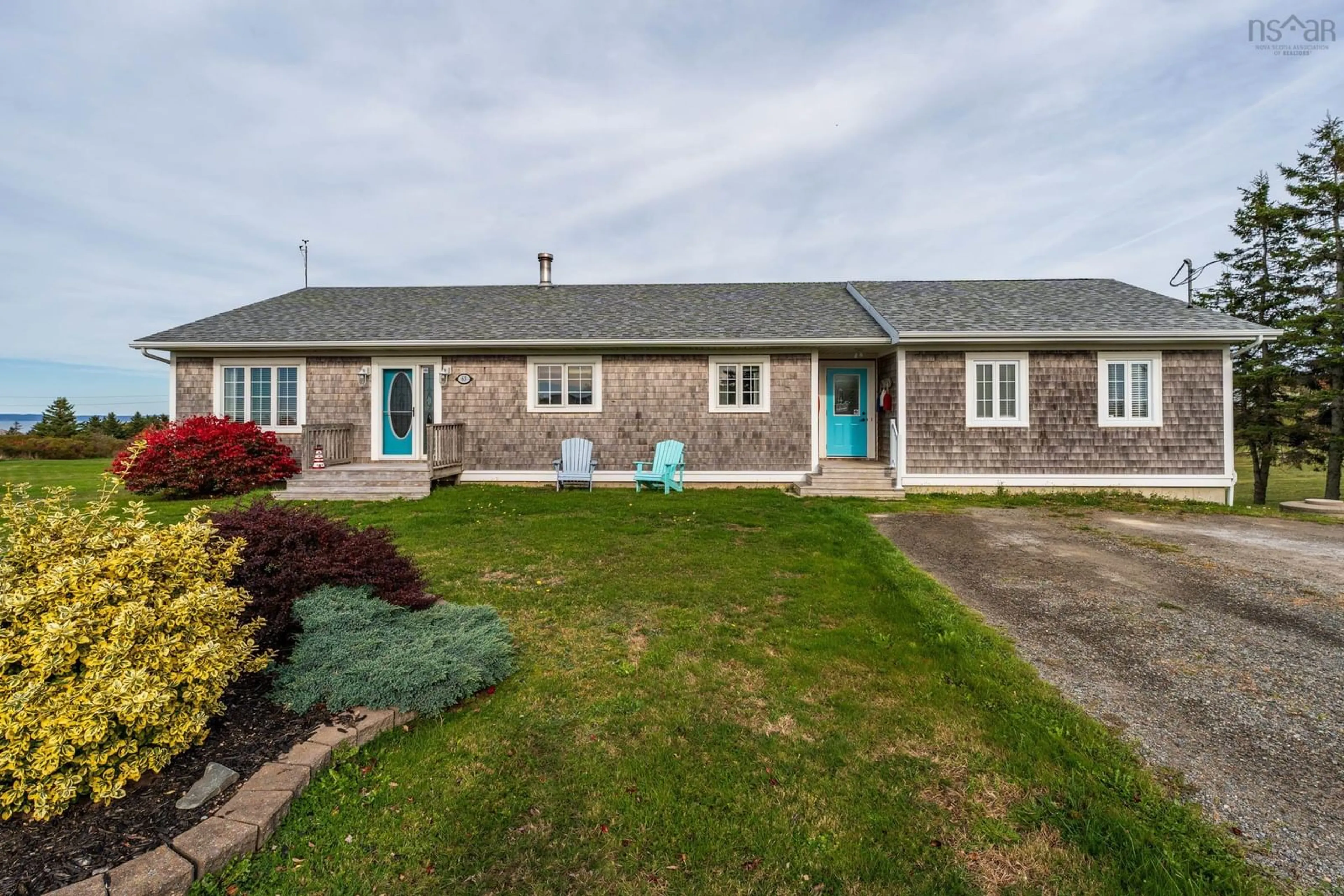 A pic from outside/outdoor area/front of a property/back of a property/a pic from drone, street for 63 Dixon Road, Grosses Coques Nova Scotia B0W 1M0